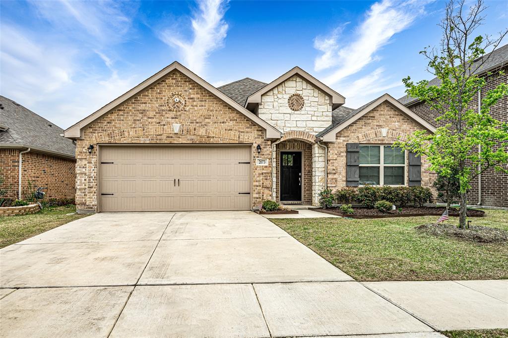 2073 Avondown Road Forney, TX 75126 - Photo 1 of 1 a front view of a house with a garden