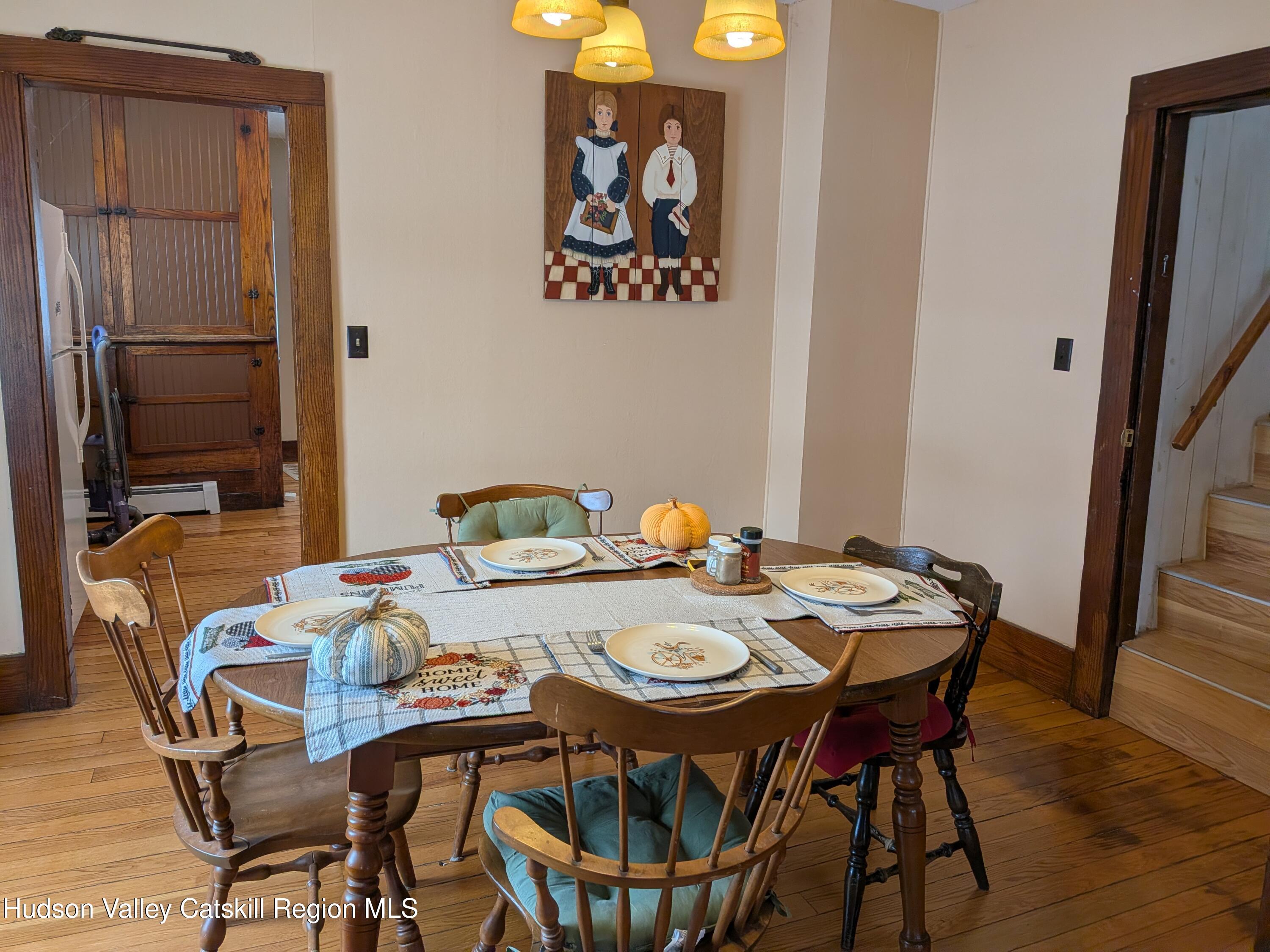 351 Presbyterian Hill Road Stephentown, NY 12168 - Photo 16 of 46 a view of a dining room that has a table and chairs