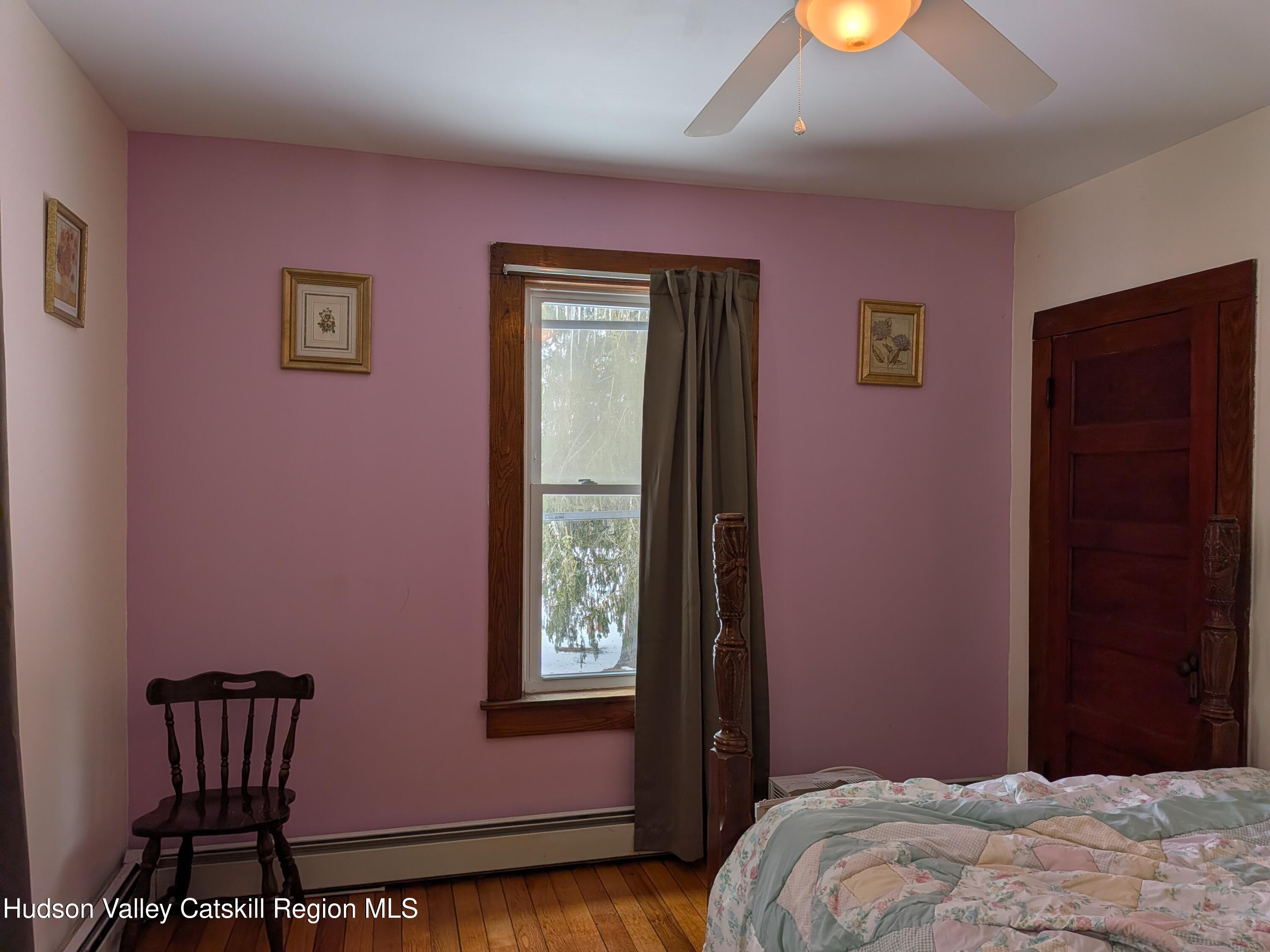 351 Presbyterian Hill Road Stephentown, NY 12168 - Photo 18 of 46 a bedroom with a bed and a window