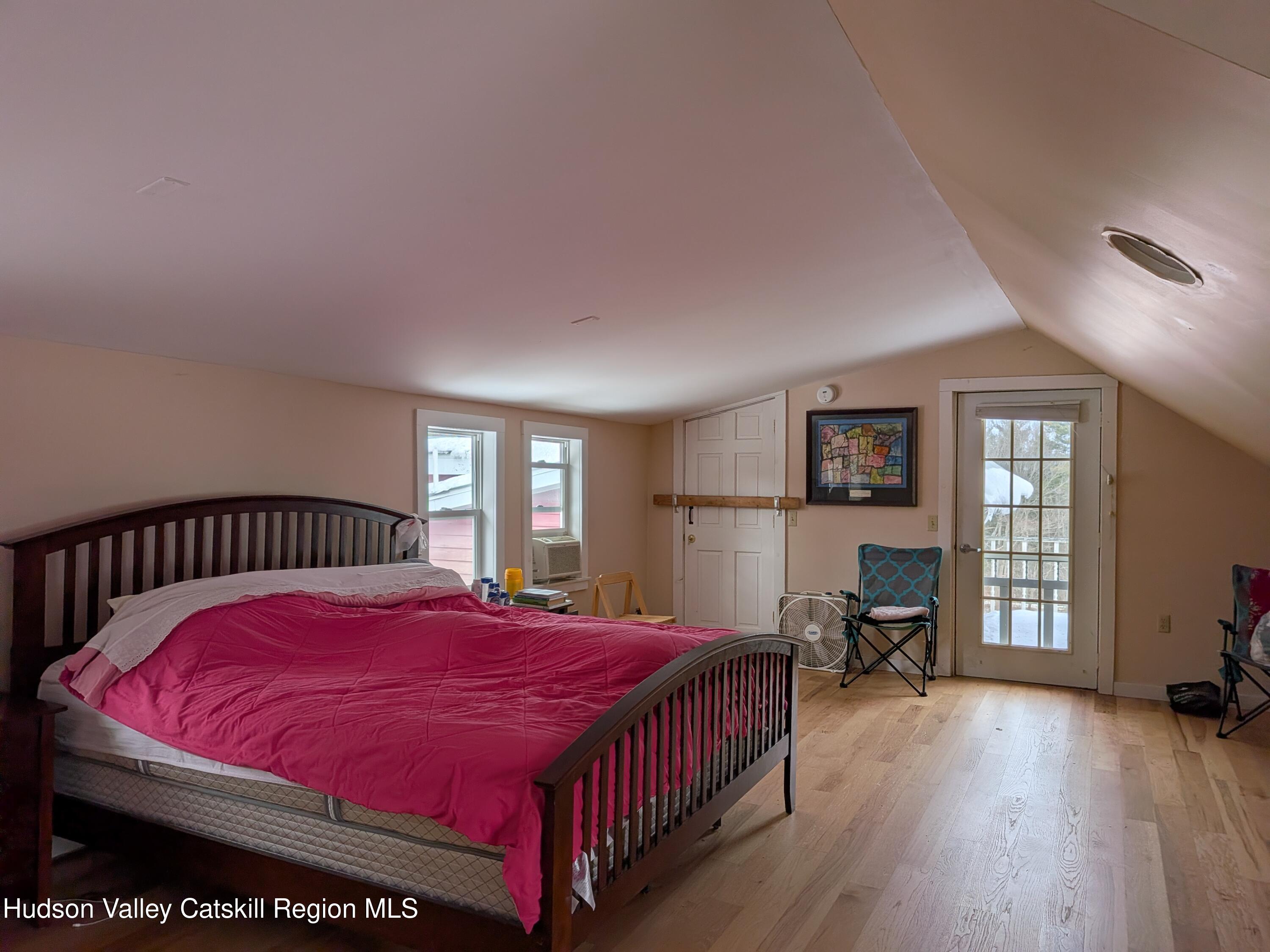 351 Presbyterian Hill Road Stephentown, NY 12168 - Photo 19 of 46 a bedroom with a large bed and a window
