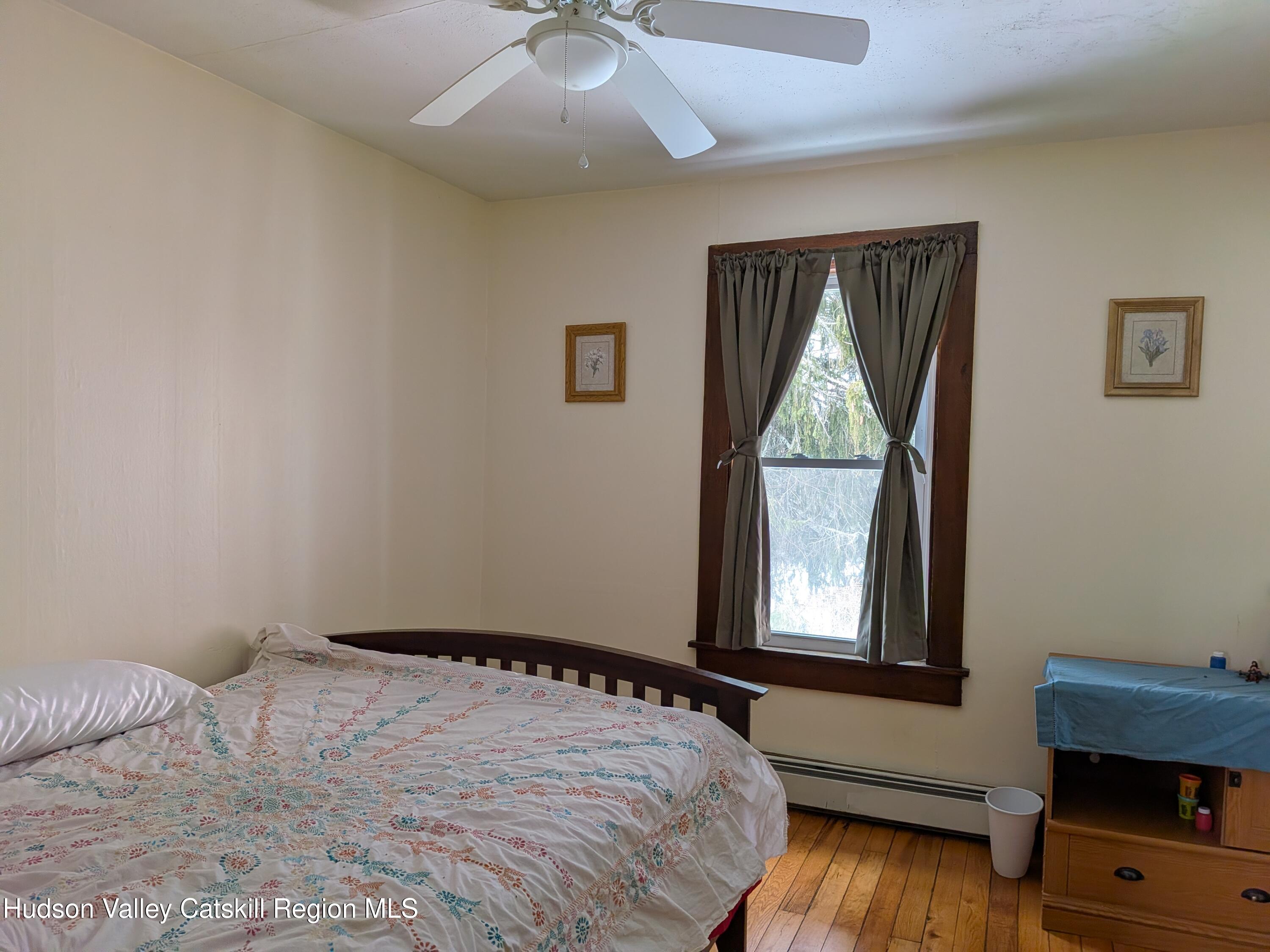 351 Presbyterian Hill Road Stephentown, NY 12168 - Photo 21 of 46 a bedroom with a bed and a window