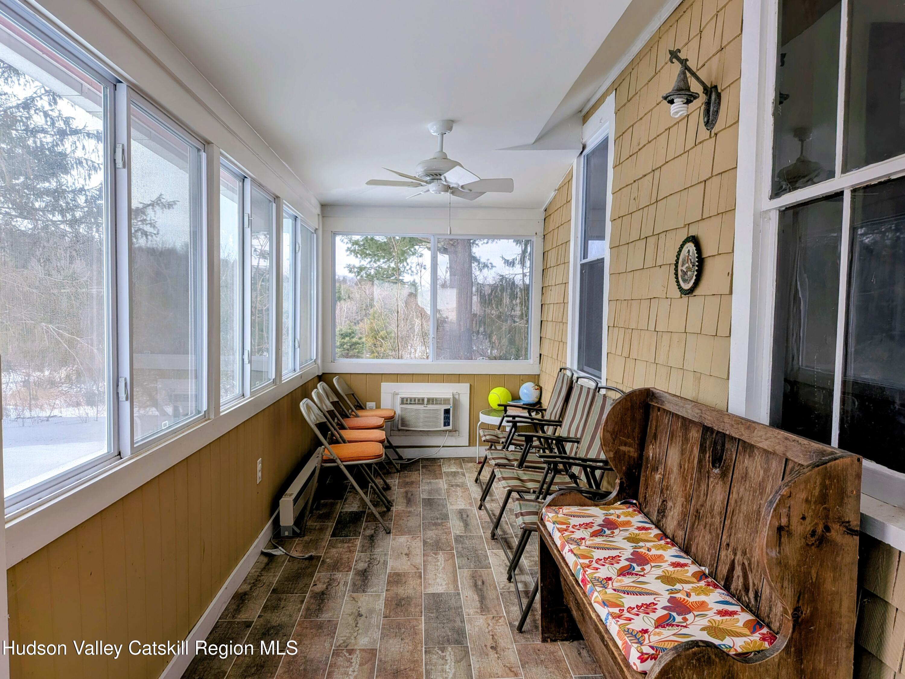 351 Presbyterian Hill Road Stephentown, NY 12168 - Photo 23 of 46 a living room with furniture and a large window