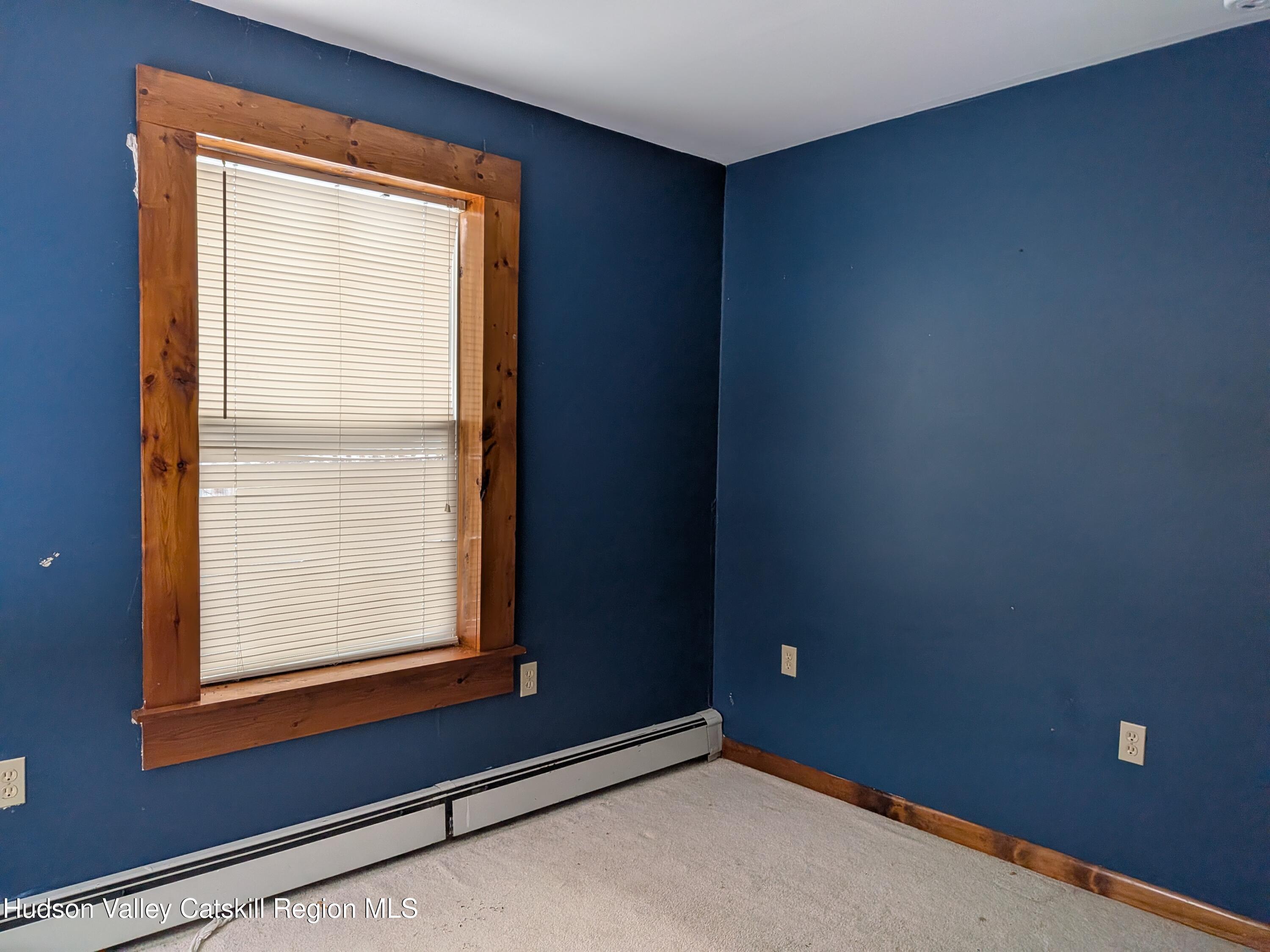 351 Presbyterian Hill Road Stephentown, NY 12168 - Photo 30 of 46 a view of an empty room with a window