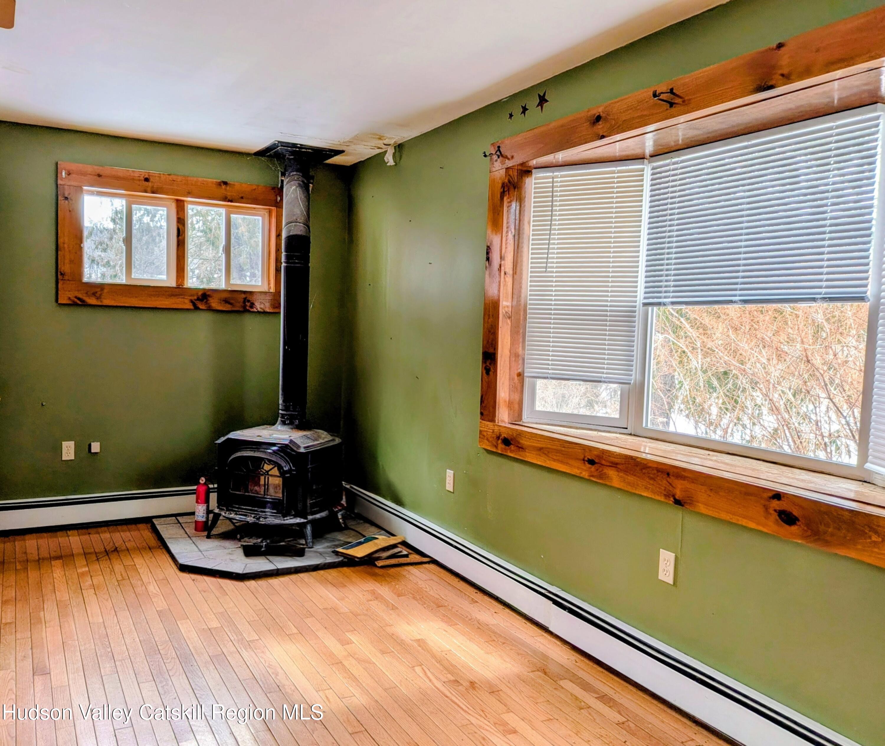 351 Presbyterian Hill Road Stephentown, NY 12168 - Photo 32 of 46 a room with pool table windows and wooden floor