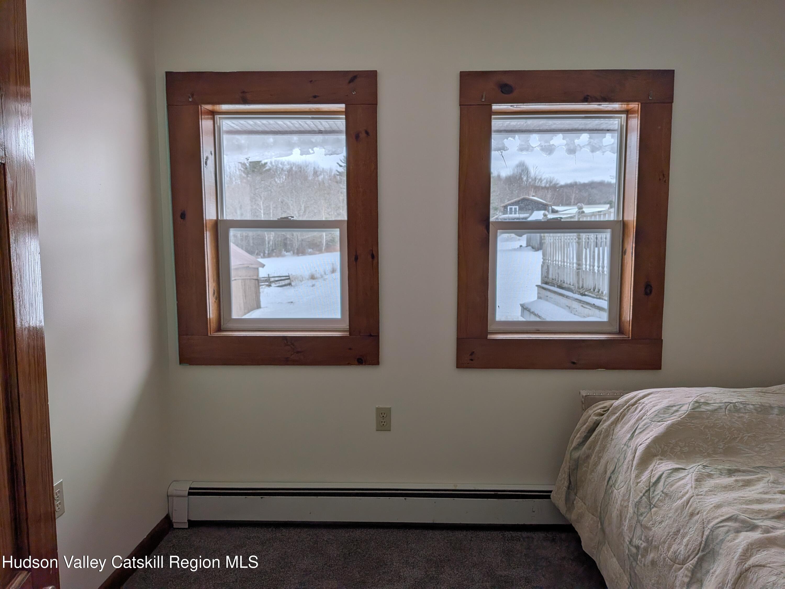 351 Presbyterian Hill Road Stephentown, NY 12168 - Photo 40 of 46 a bedroom with a bed and a window