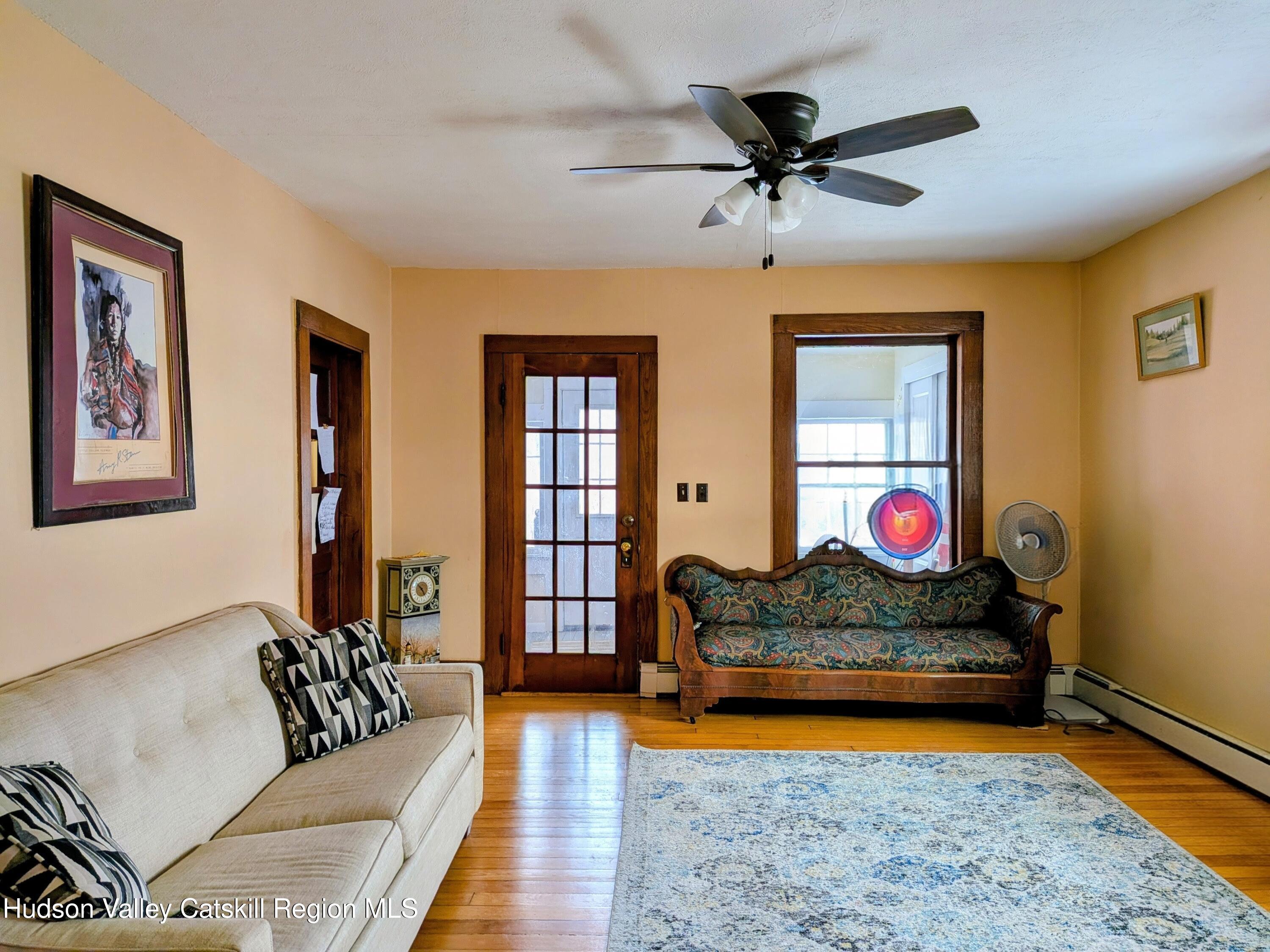 351 Presbyterian Hill Road Stephentown, NY 12168 - Photo 9 of 46 a living room with furniture and a window