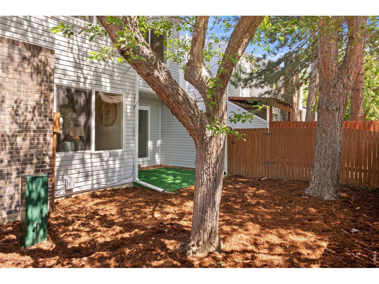 7422 Clubhouse Road Boulder, CO 80301 - Photo 21 of 25 Fenced back yard with mature trees