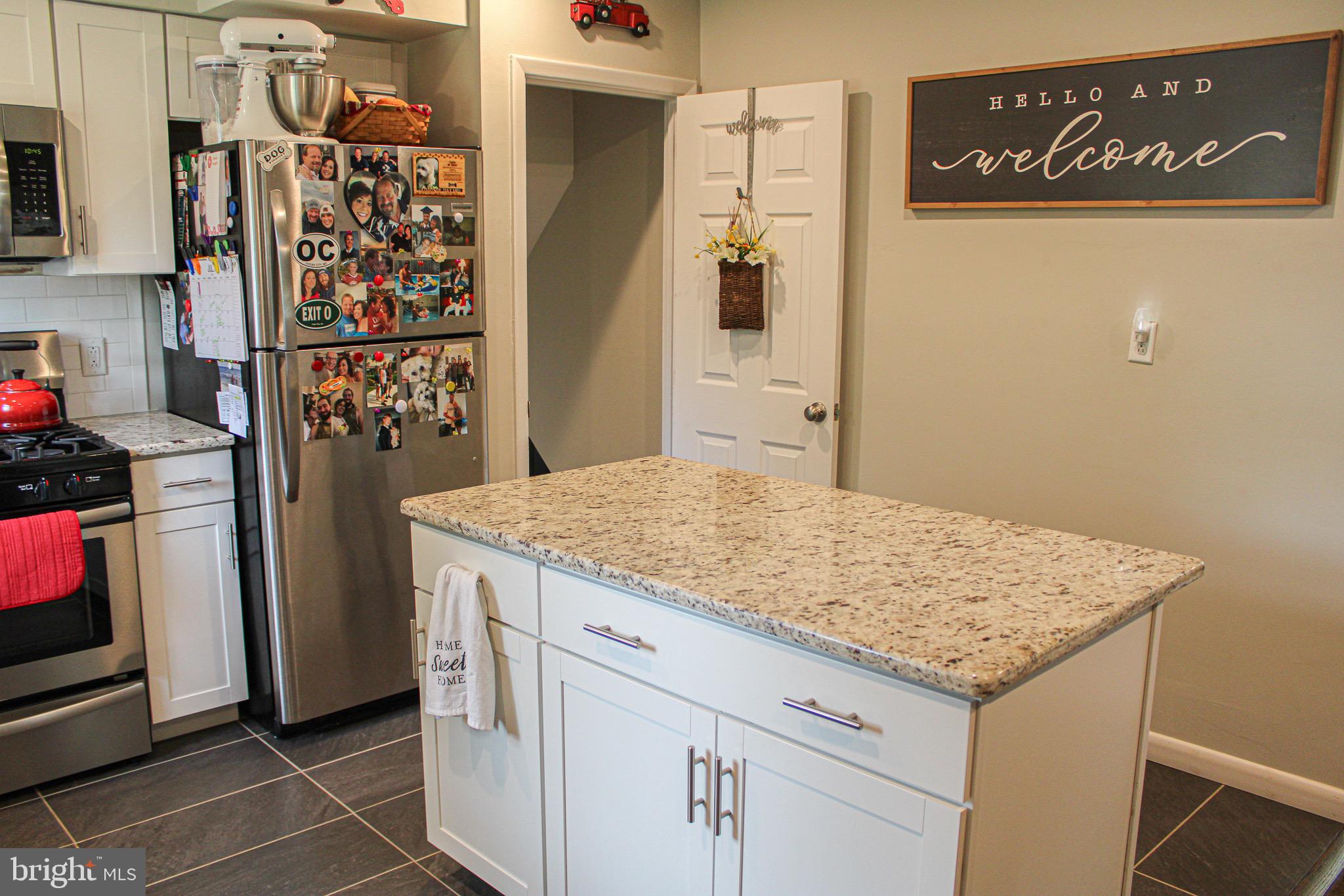 963 Windsor Road Warminster, PA 18974 - Photo 13 of 36 a kitchen with stainless steel appliances granite countertop a refrigerator and a stove