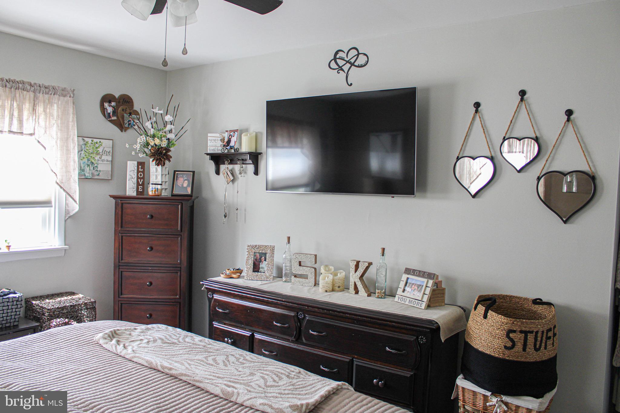 963 Windsor Road Warminster, PA 18974 - Photo 16 of 36 a bedroom with a bed and wooden floor