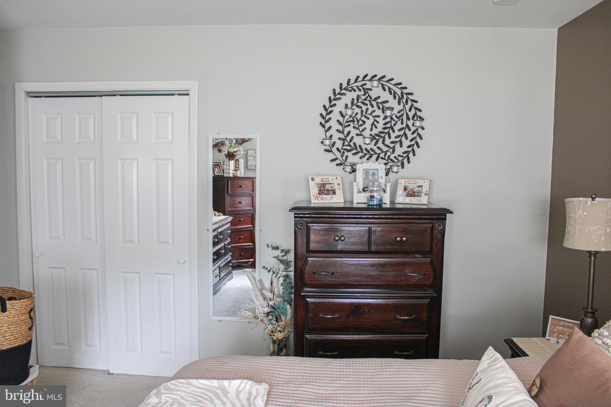 963 Windsor Road Warminster, PA 18974 - Photo 17 of 36 a bedroom with a bed and a chandelier