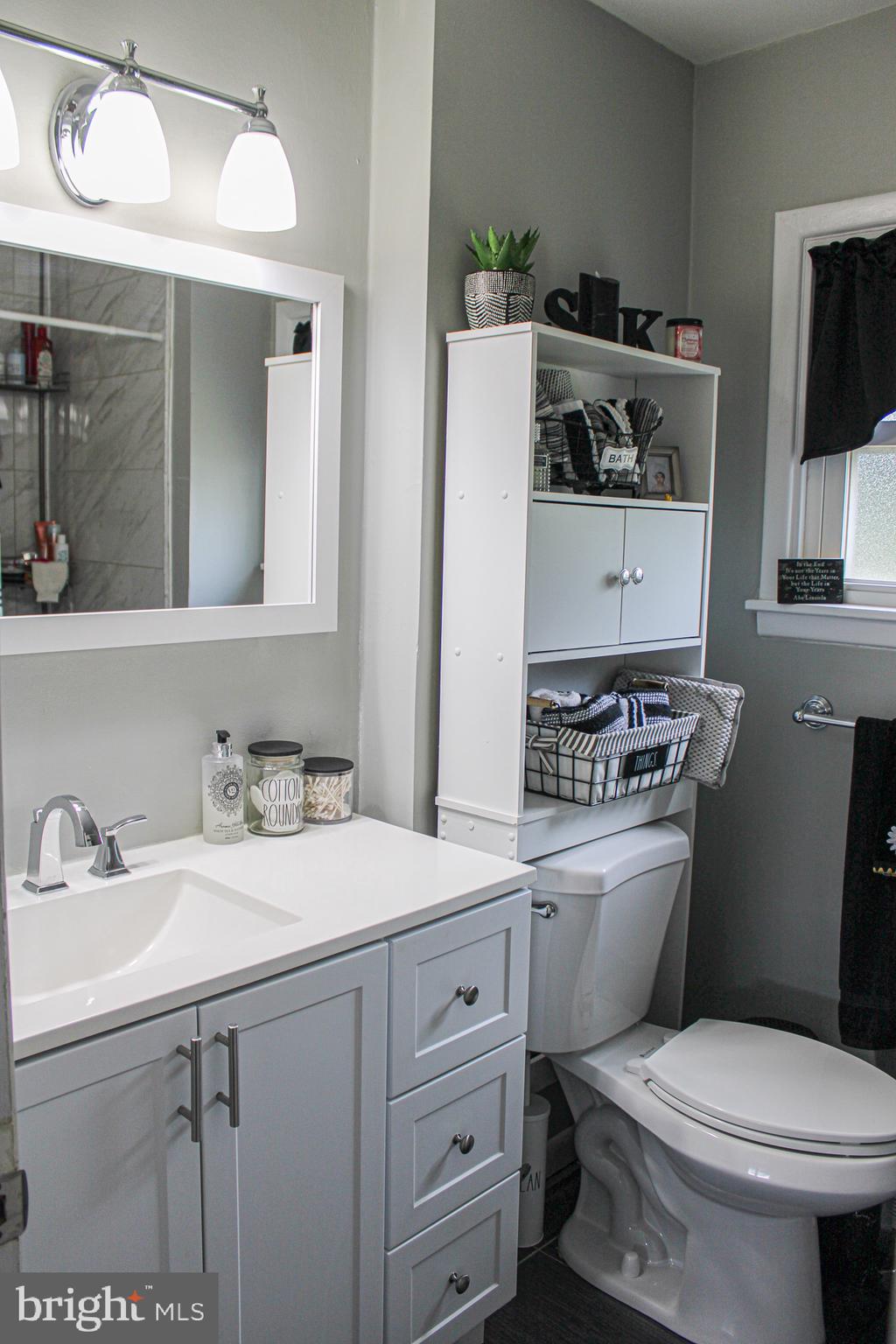 963 Windsor Road Warminster, PA 18974 - Photo 18 of 36 a bathroom with a toilet sink and mirror