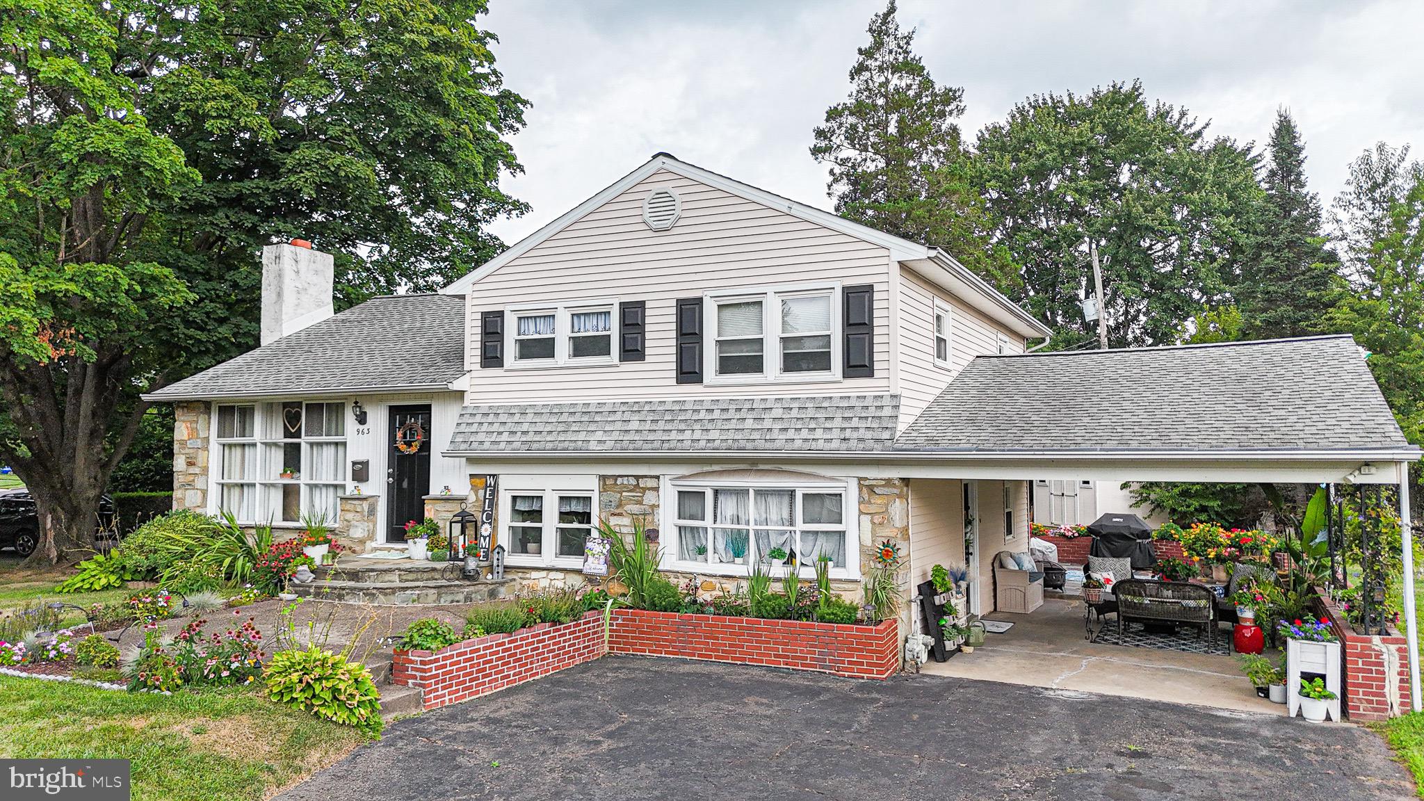 963 Windsor Road Warminster, PA 18974 - Photo 2 of 36 a front view of a house with garden
