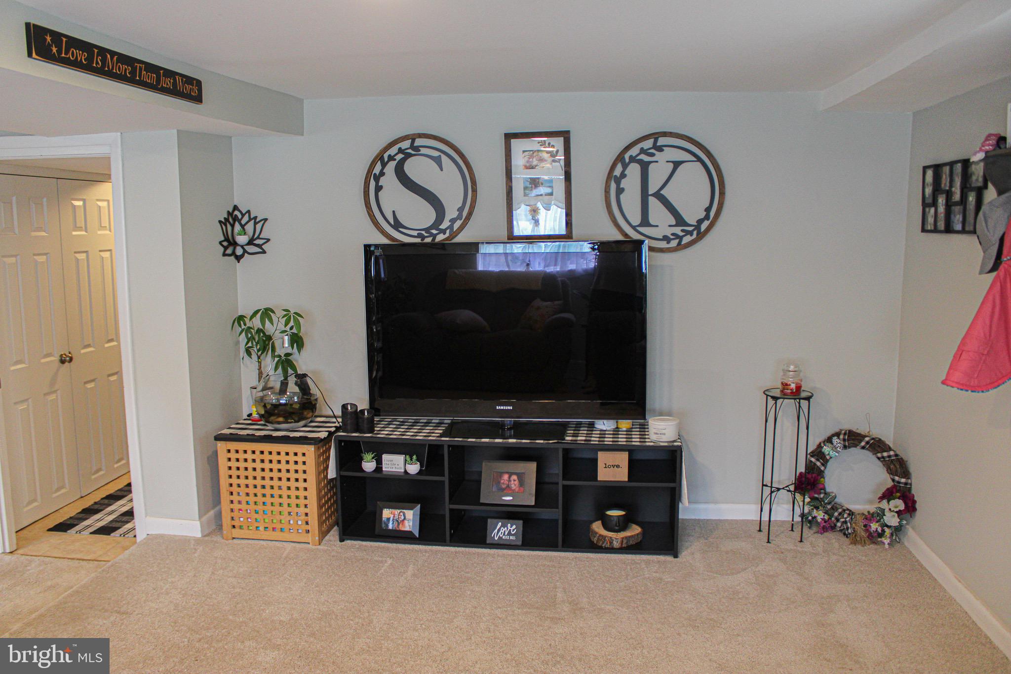 963 Windsor Road Warminster, PA 18974 - Photo 26 of 36 a living room with furniture and a flat screen tv