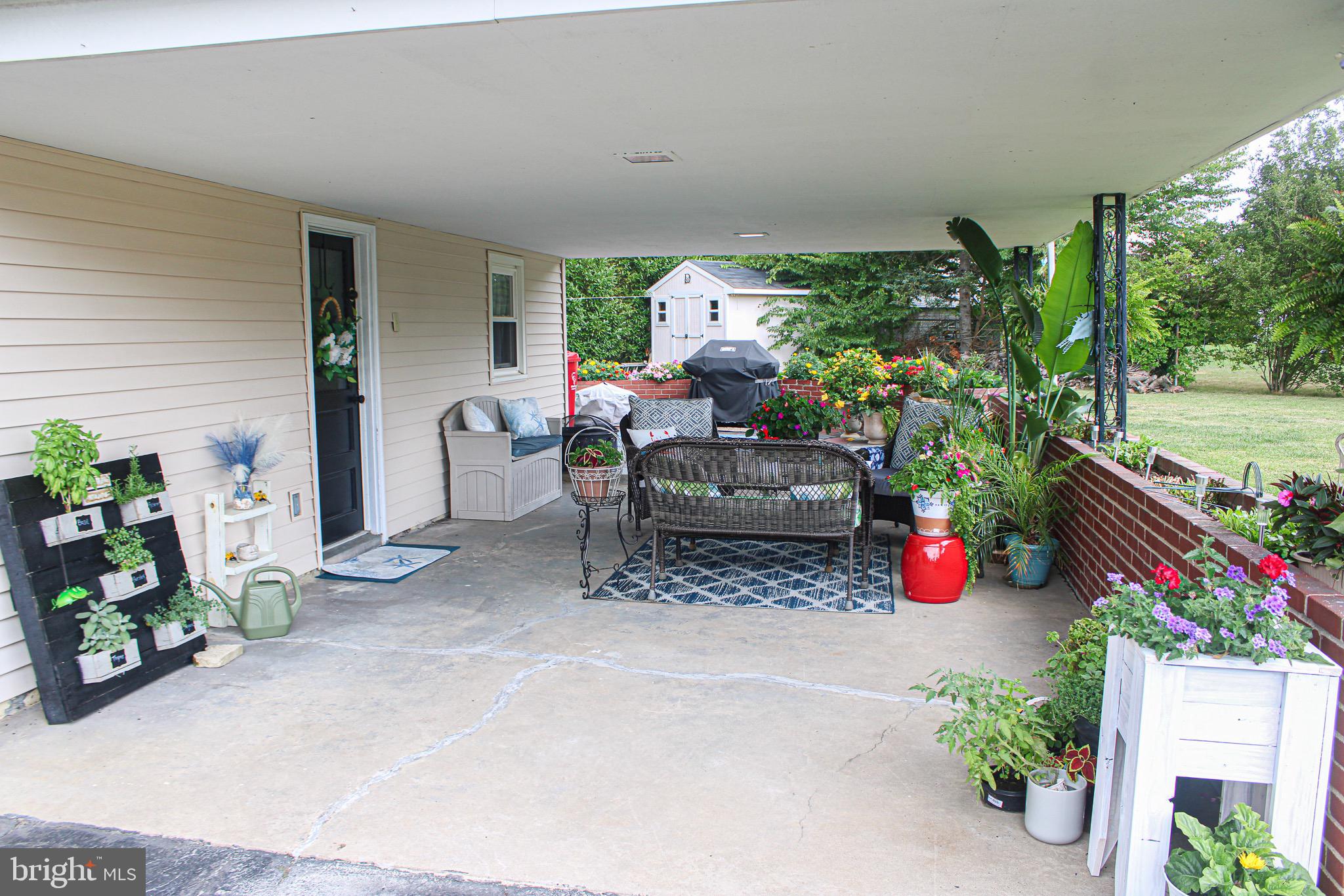 963 Windsor Road Warminster, PA 18974 - Photo 29 of 36 a view of a patio with table and chairs potted plants