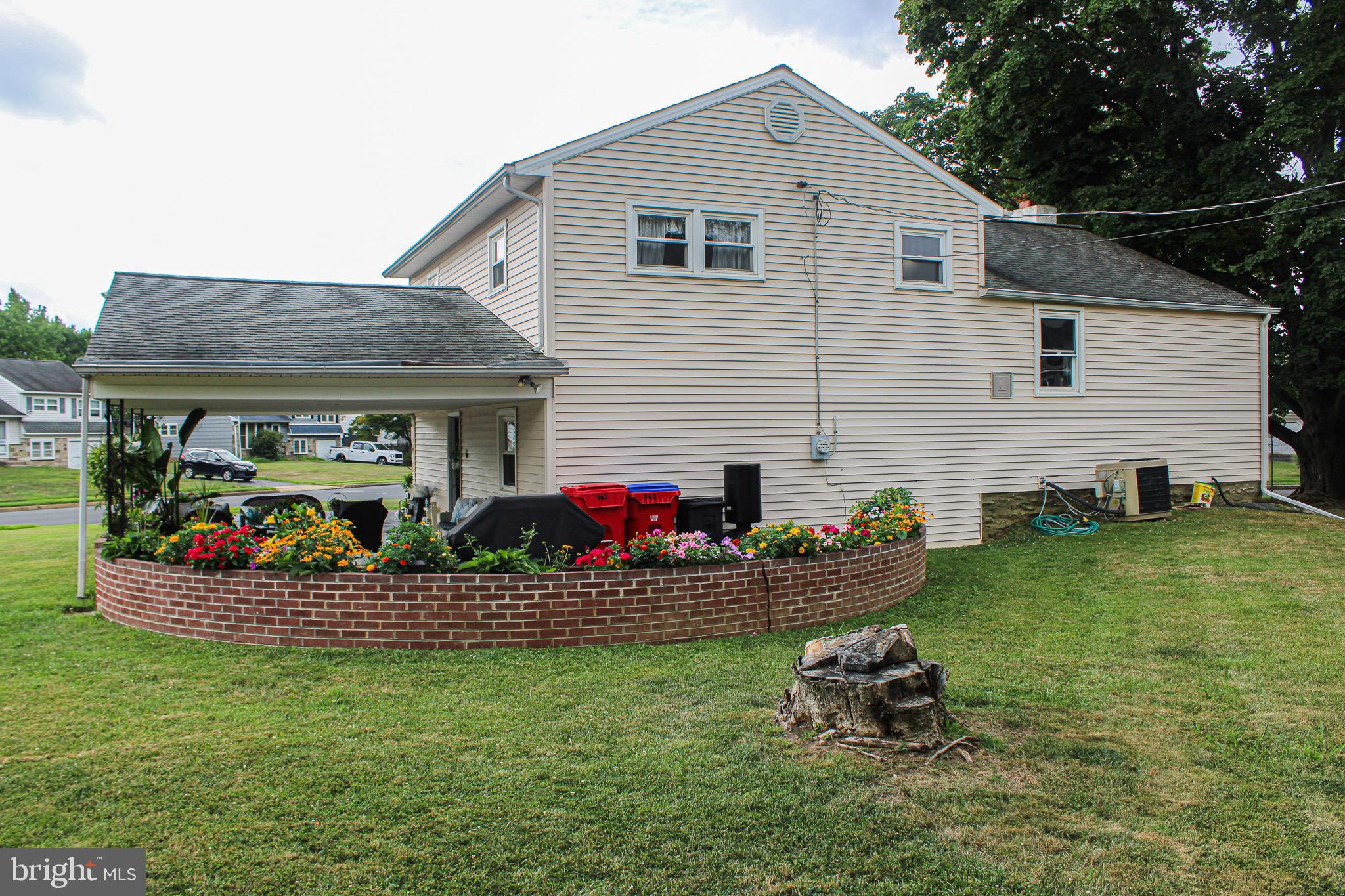 963 Windsor Road Warminster, PA 18974 - Photo 31 of 36 a front view of house with yard and outdoor seating