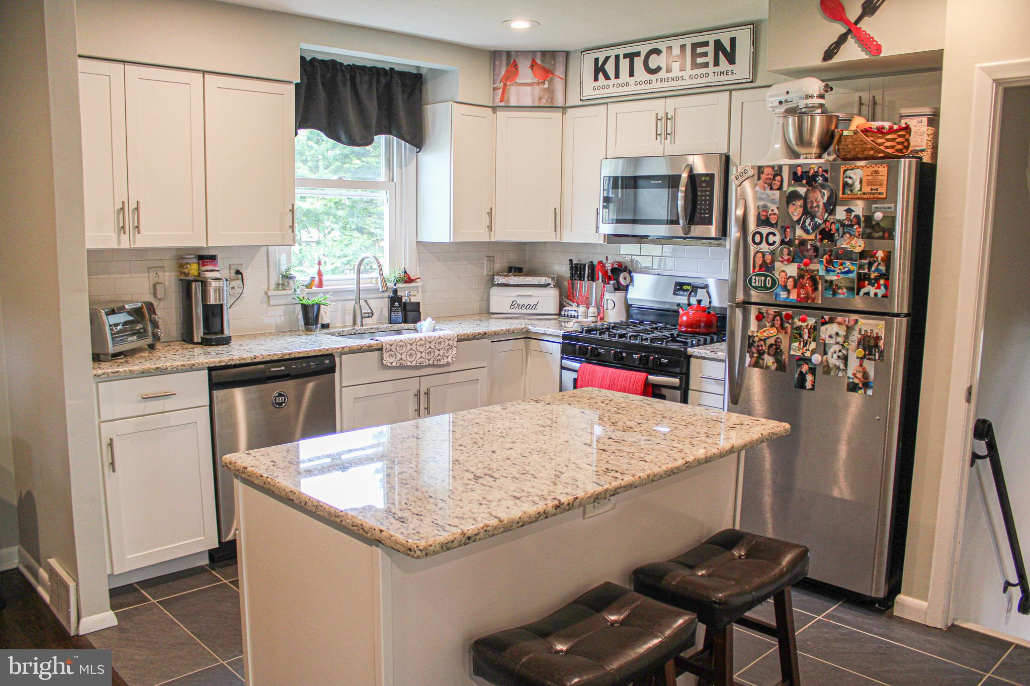 963 Windsor Road Warminster, PA 18974 - Photo 9 of 36 a kitchen with stainless steel appliances granite countertop a sink stove and refrigerator