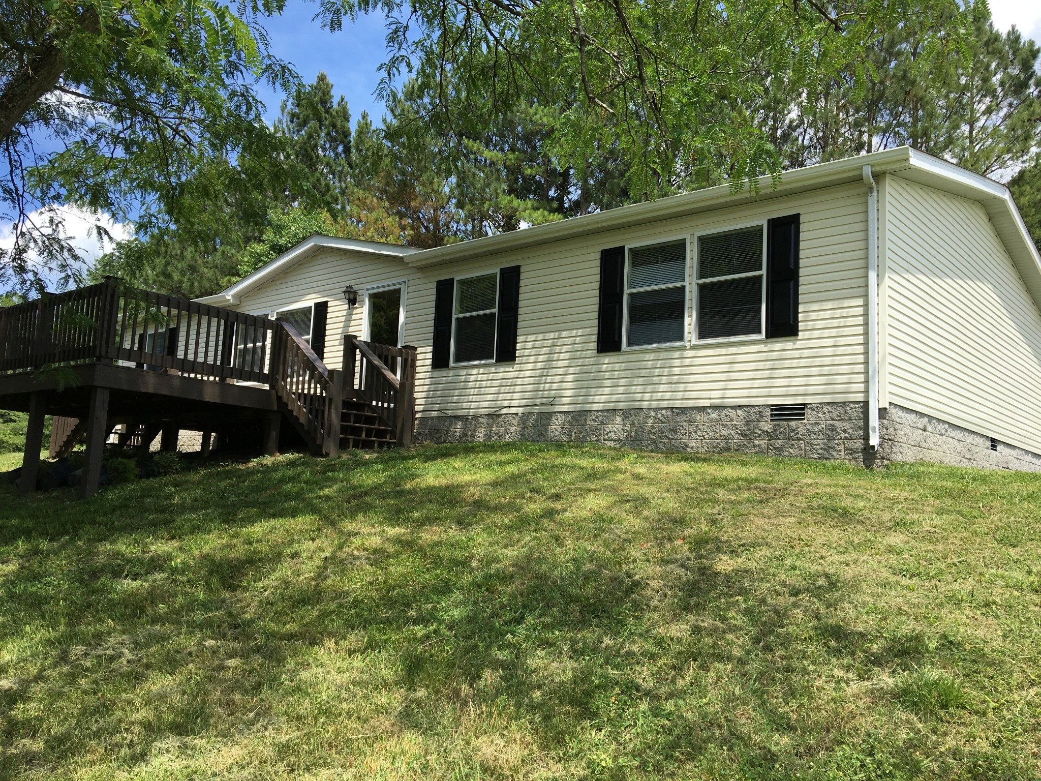 991 Berea Church Road Lebanon, TN 37087 - Photo 1 of 17 a house with green field in front of it