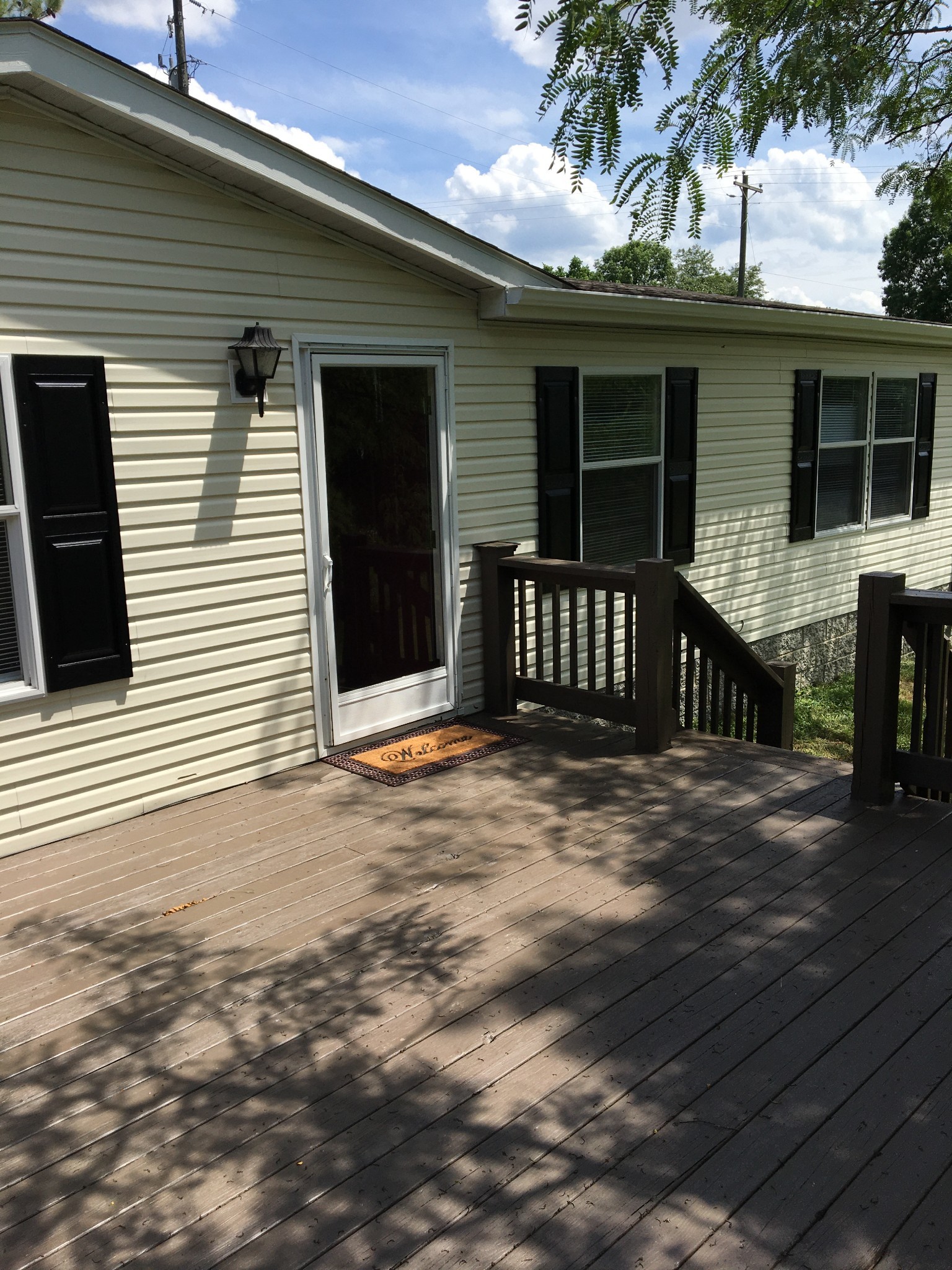 991 Berea Church Road Lebanon, TN 37087 - Photo 4 of 17 a view of a house with a wooden deck