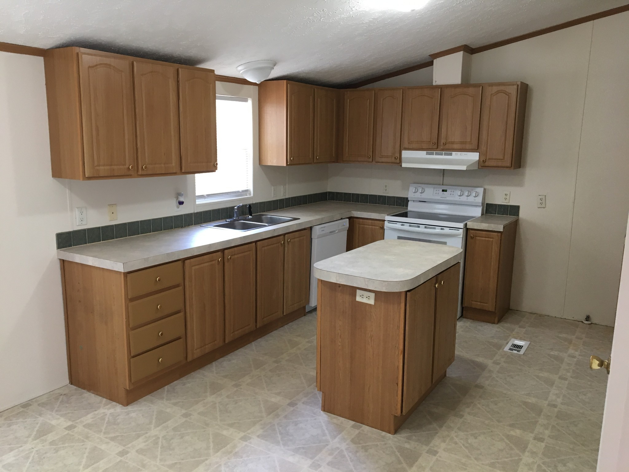 991 Berea Church Road Lebanon, TN 37087 - Photo 8 of 17 a kitchen with a stove sink and cabinets