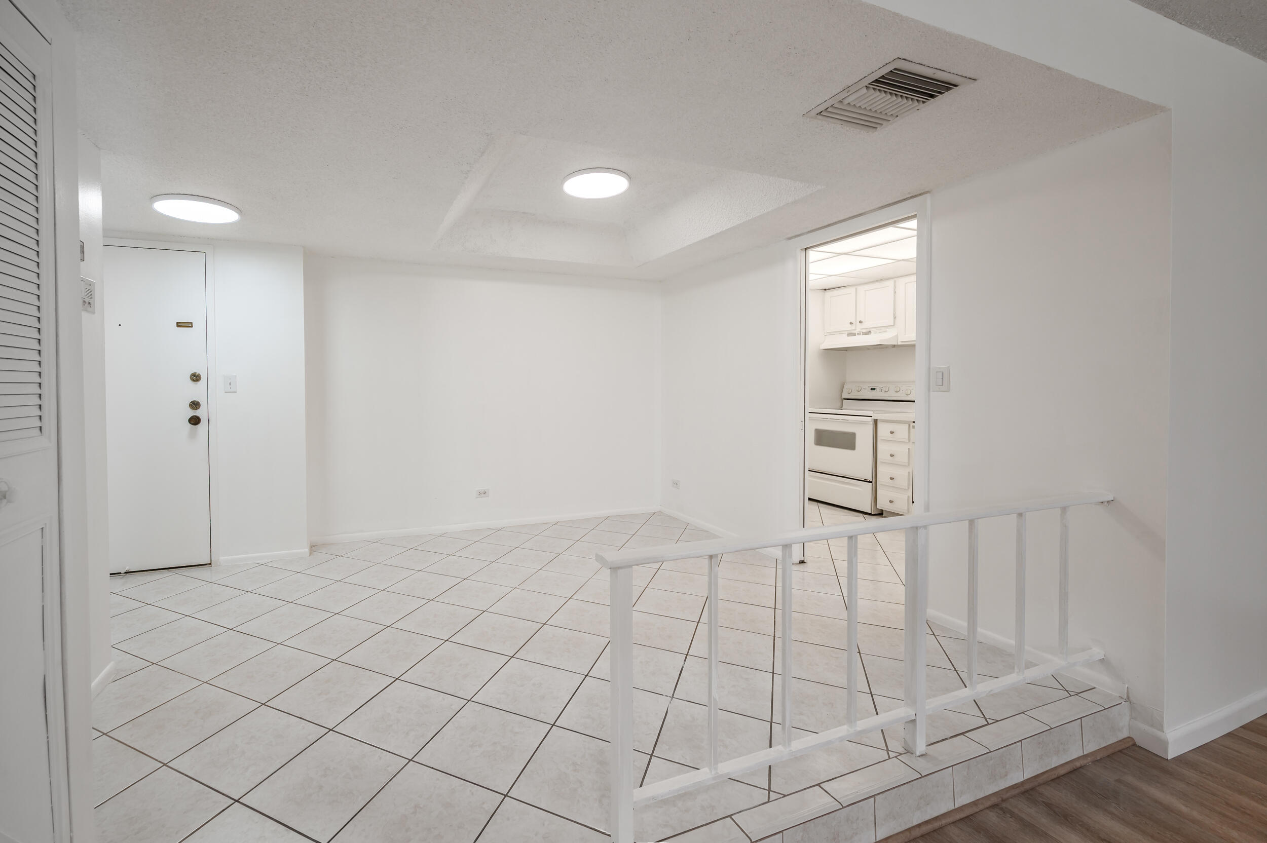 3660 Inverrary Drive, Unit 3Q Lauderhill, FL 33319 - Photo 11 of 35 a view of an empty room and wooden floor
