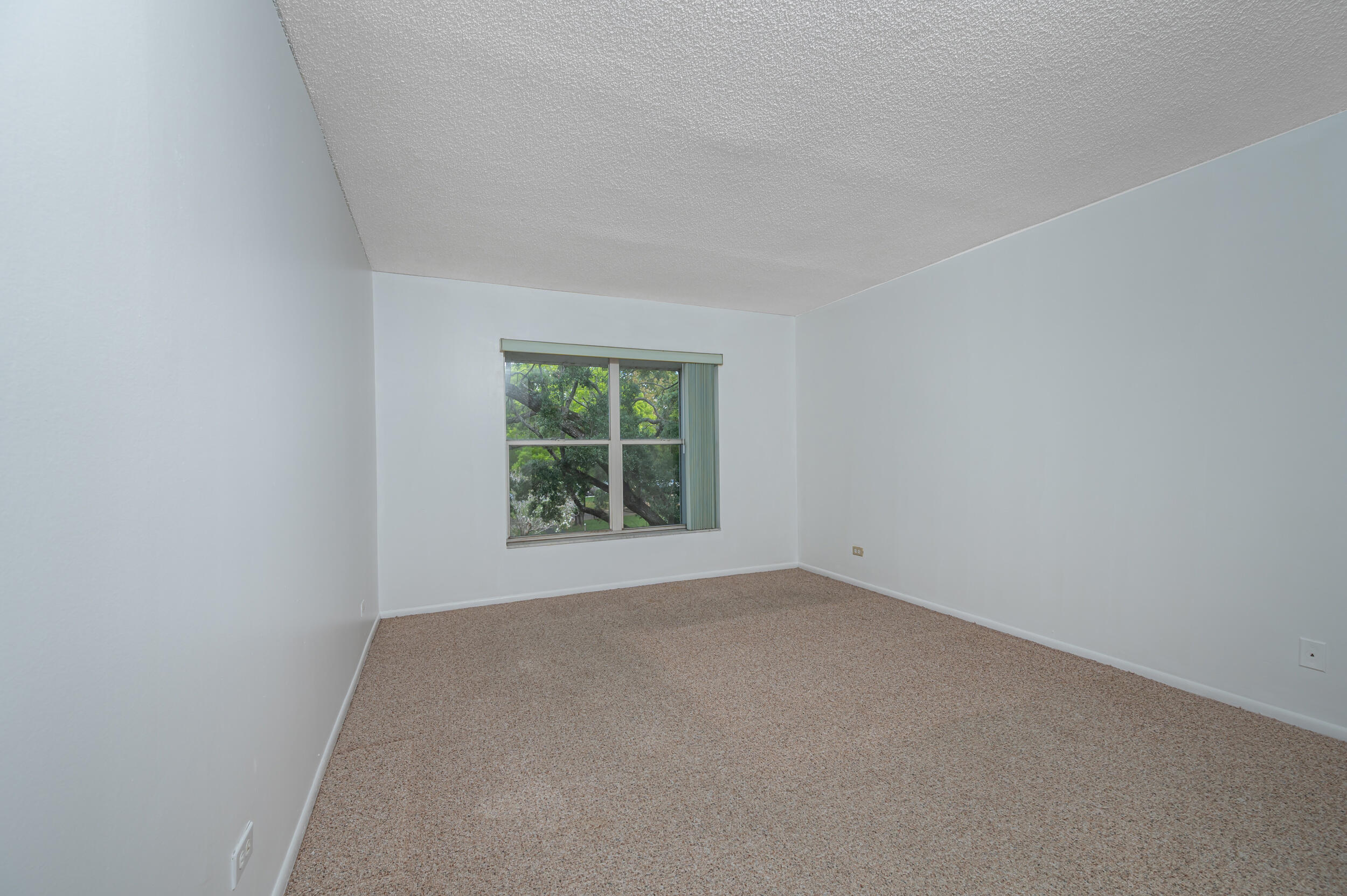 3660 Inverrary Drive, Unit 3Q Lauderhill, FL 33319 - Photo 19 of 35 an empty room with a window