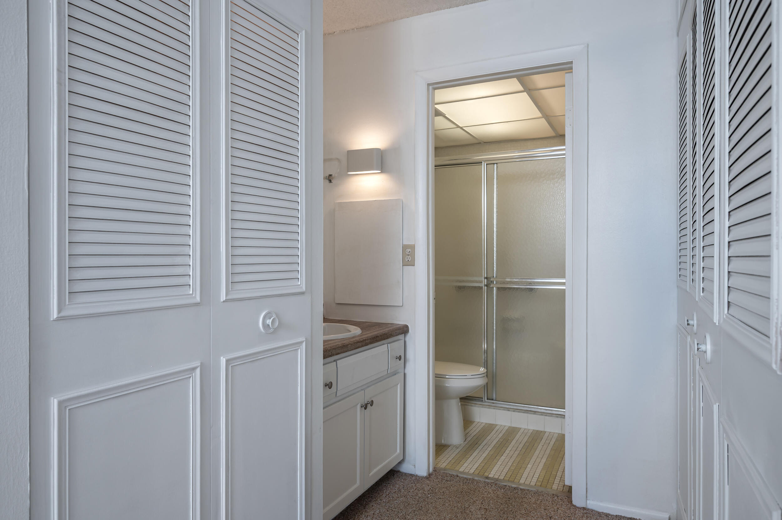 3660 Inverrary Drive, Unit 3Q Lauderhill, FL 33319 - Photo 20 of 35 a bathroom with a toilet sink and shower