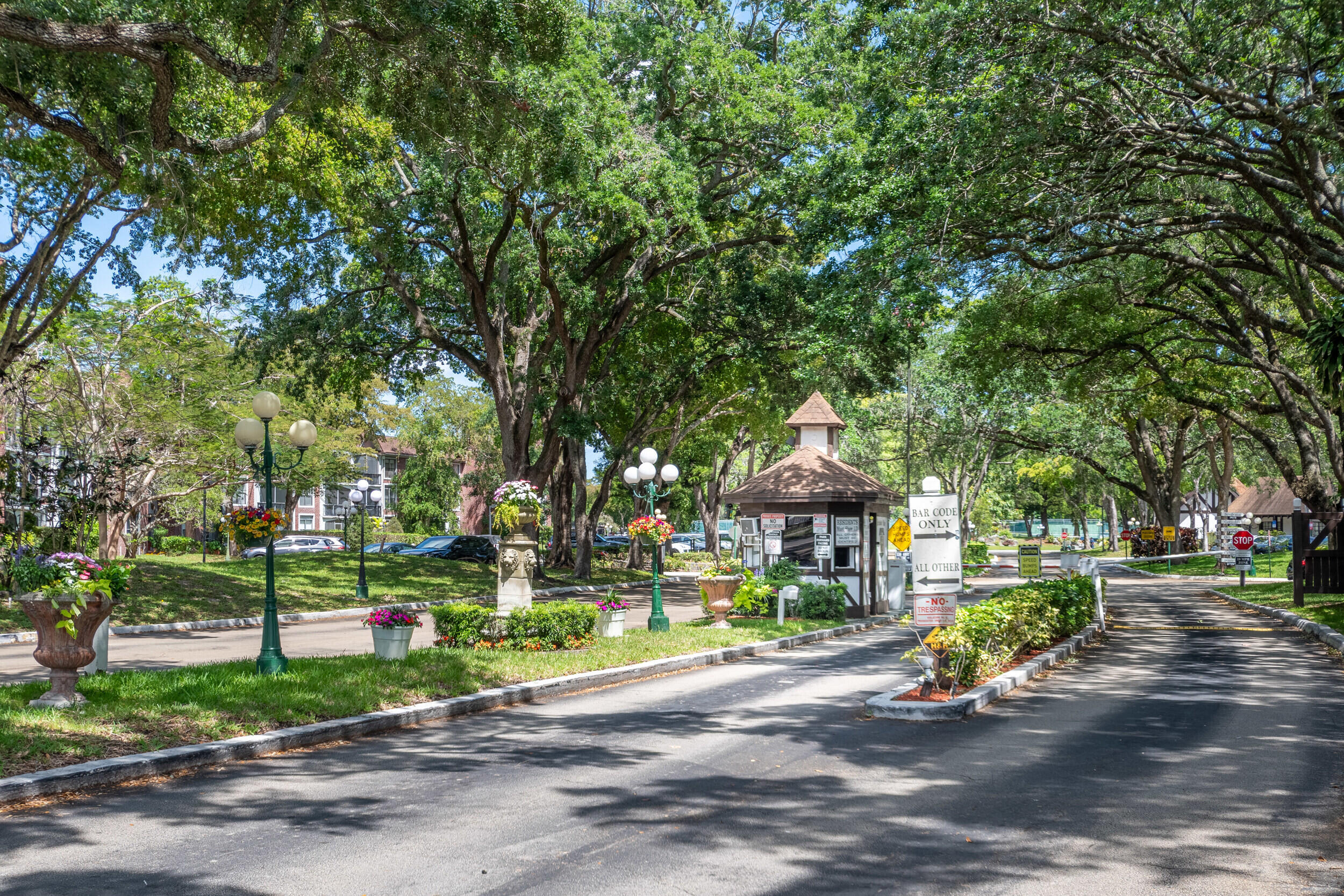 3660 Inverrary Drive, Unit 3Q Lauderhill, FL 33319 - Photo 27 of 35 a front view of a house with a yard and green space