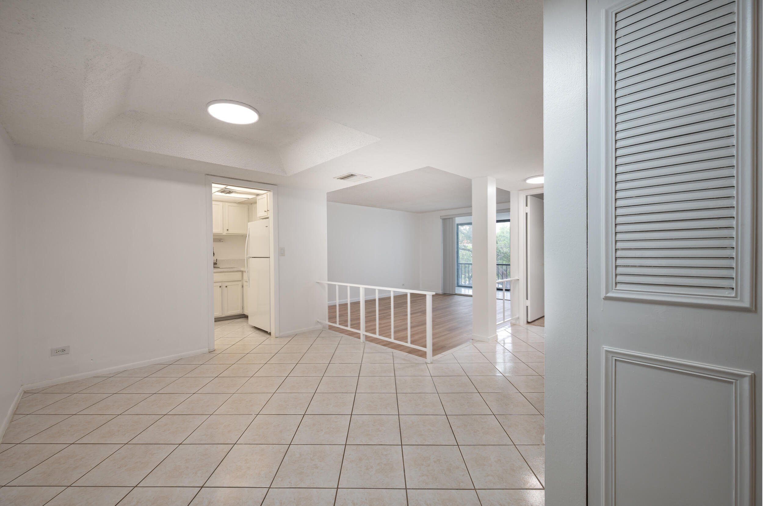 3660 Inverrary Drive, Unit 3Q Lauderhill, FL 33319 - Photo 8 of 35 a view of a livingroom with a staircase