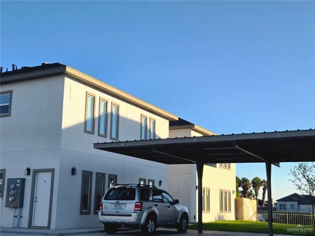 a view of a car parked on the side of a road