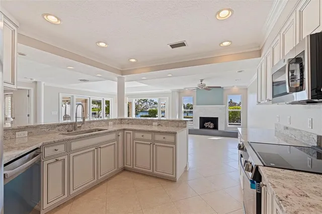 a kitchen with a sink stove and cabinets
