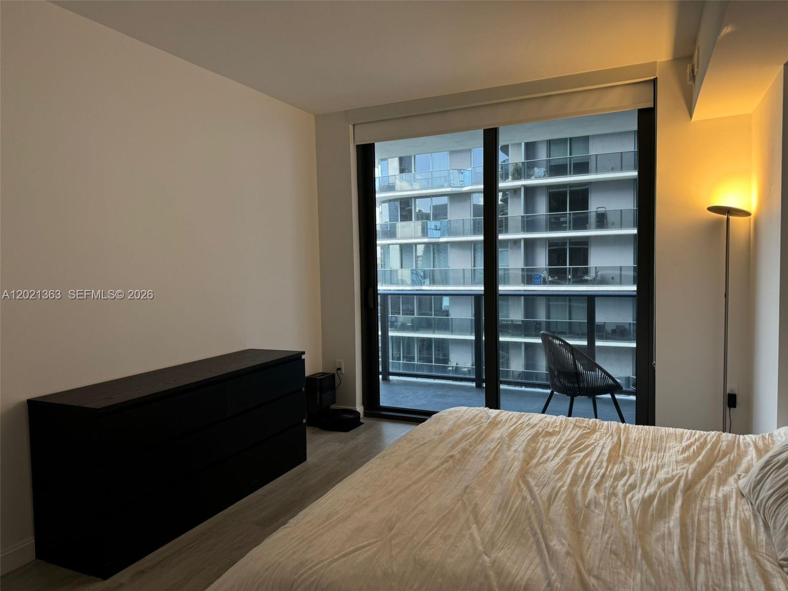 45 Southwest 9th Street, Unit 3107 Miami, FL 33130 - Photo 6 of 12 a bedroom with a bed and closet
