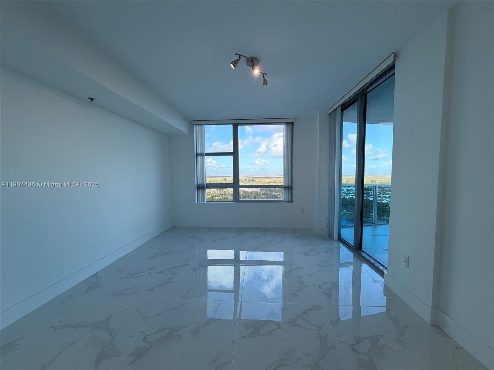 2641 North Flamingo Road, Unit 2208N Sunrise, FL 33323 - Photo 22 of 56 an empty room with windows