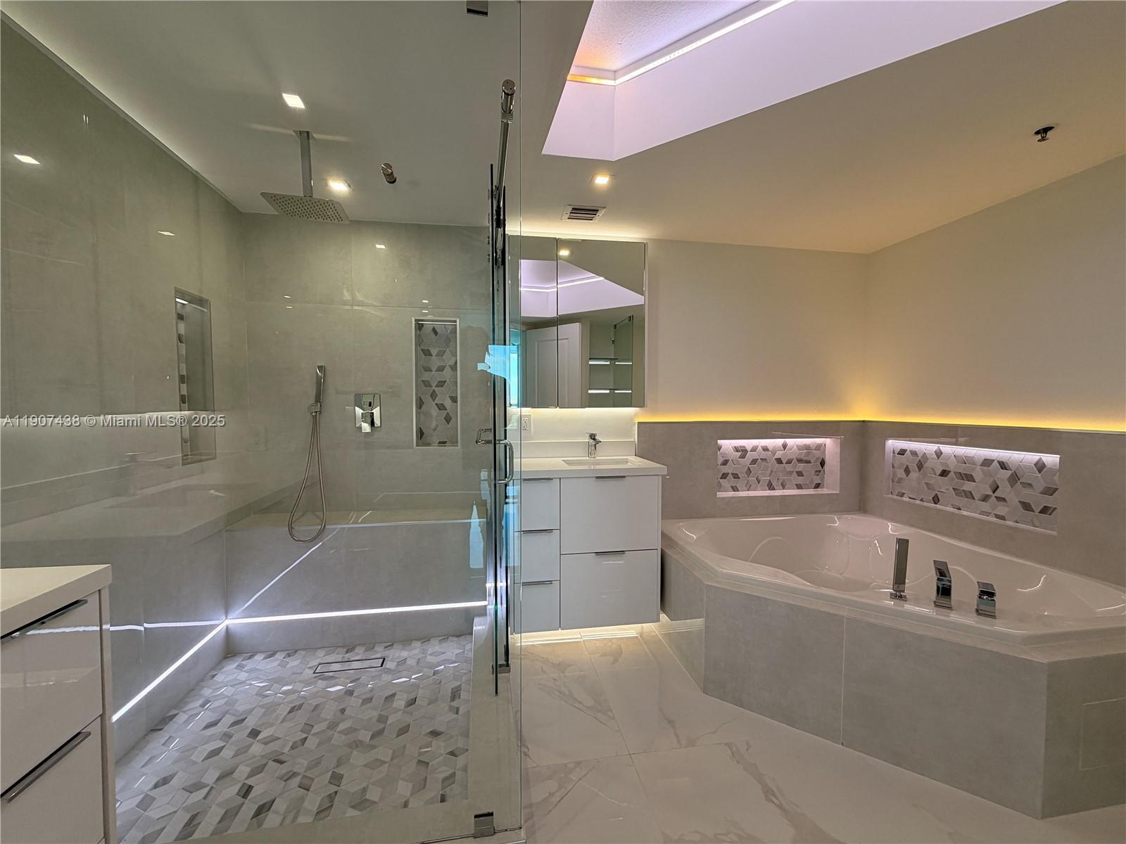 2641 North Flamingo Road, Unit 2208N Sunrise, FL 33323 - Photo 23 of 56 a bathroom with a bathtub and a sink