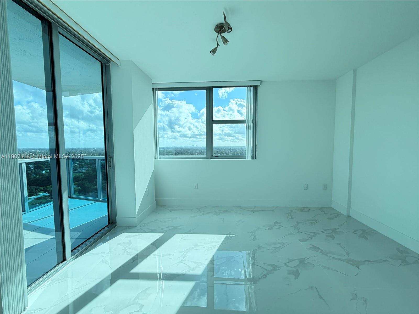 2641 North Flamingo Road, Unit 2208N Sunrise, FL 33323 - Photo 33 of 56 a view of an empty room with glass door