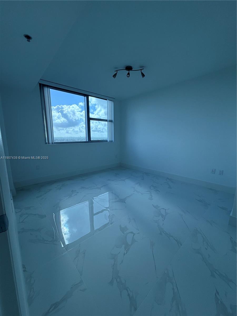 2641 North Flamingo Road, Unit 2208N Sunrise, FL 33323 - Photo 38 of 56 an empty room with windows