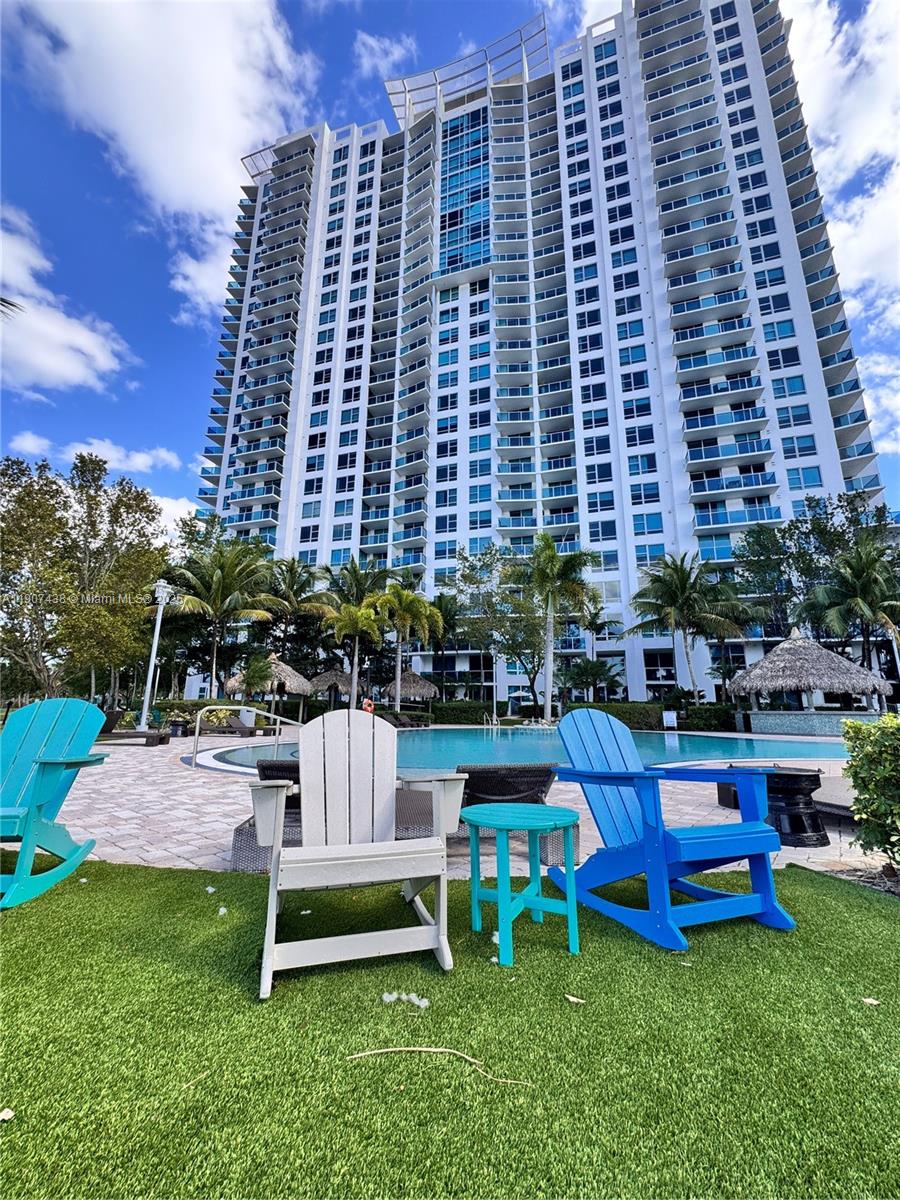 2641 North Flamingo Road, Unit 2208N Sunrise, FL 33323 - Photo 41 of 56 a front view of a building with outdoor seating
