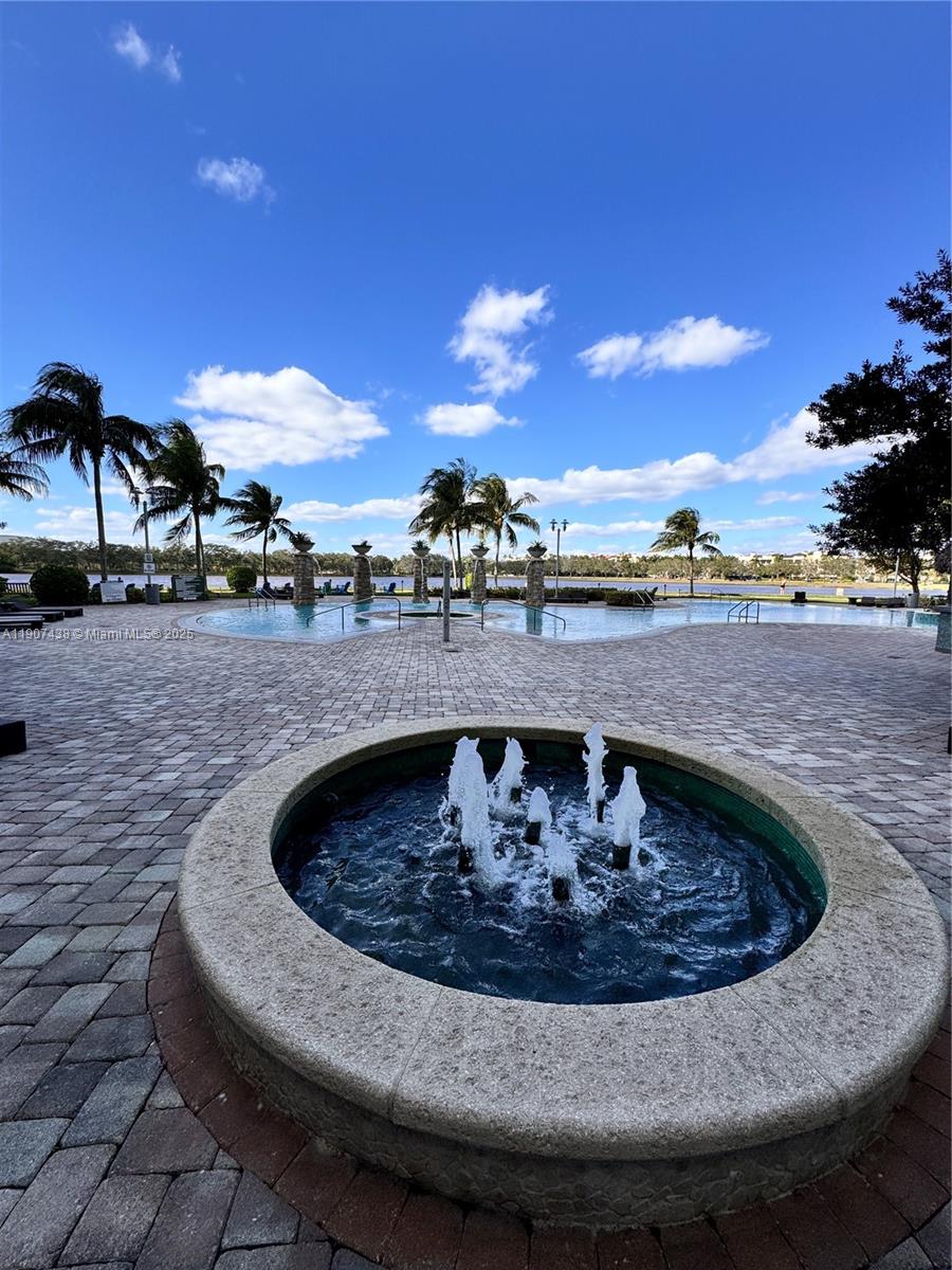 2641 North Flamingo Road, Unit 2208N Sunrise, FL 33323 - Photo 44 of 56 a view of a swimming pool with a yard