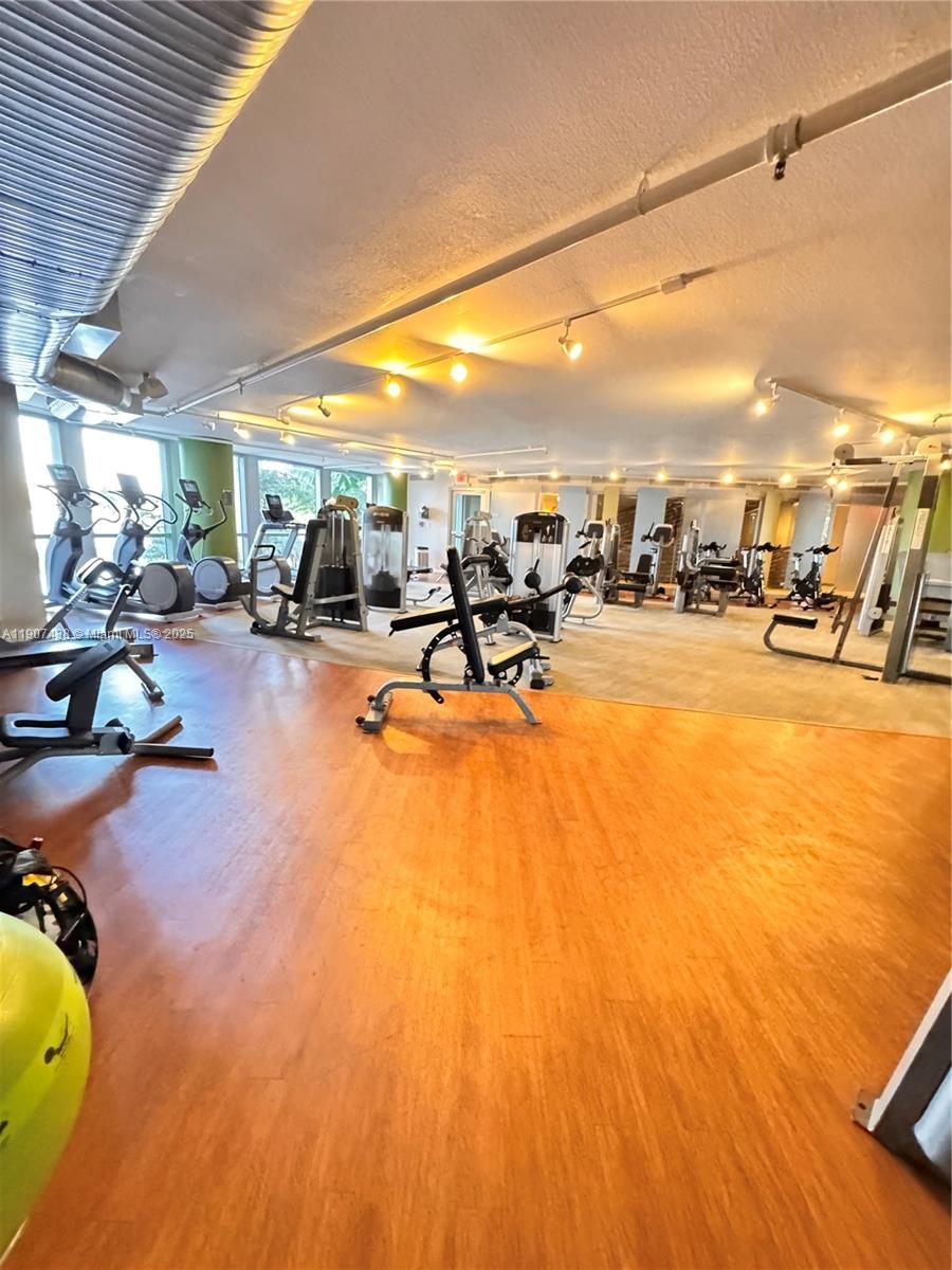 2641 North Flamingo Road, Unit 2208N Sunrise, FL 33323 - Photo 45 of 56 a view of a swimming pool with outdoor seating