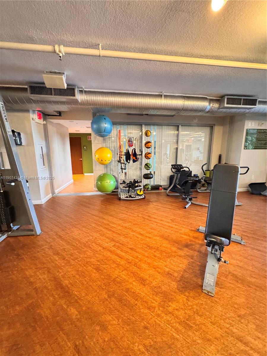 2641 North Flamingo Road, Unit 2208N Sunrise, FL 33323 - Photo 47 of 56 a view of a room with gym equipment