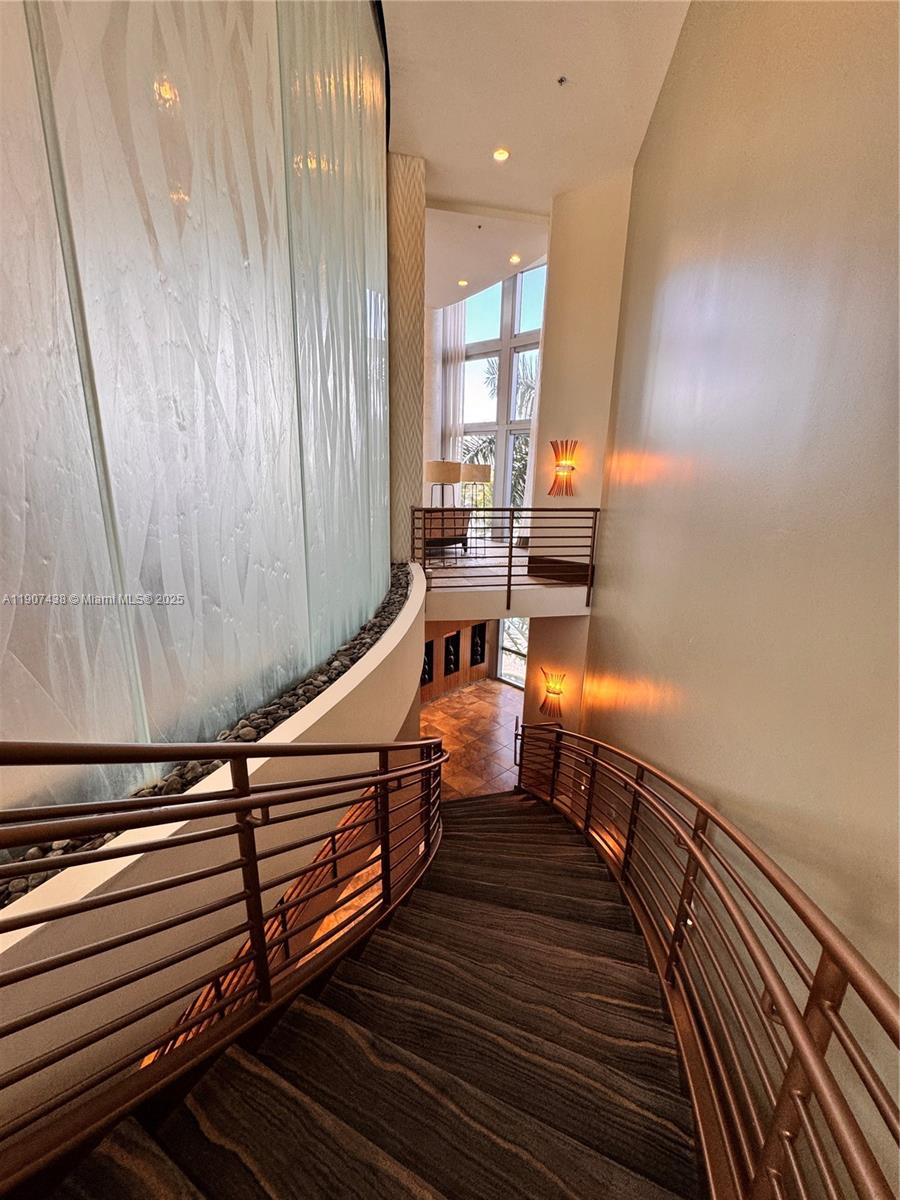 2641 North Flamingo Road, Unit 2208N Sunrise, FL 33323 - Photo 52 of 56 a reading room with wooden floor pool table and chairs