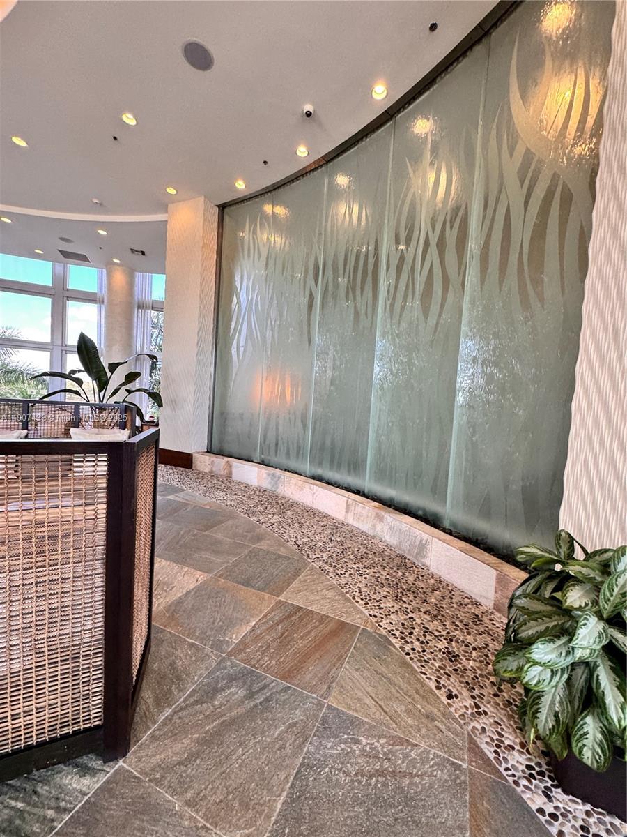 2641 North Flamingo Road, Unit 2208N Sunrise, FL 33323 - Photo 54 of 56 a bathroom with a sink and a mirror