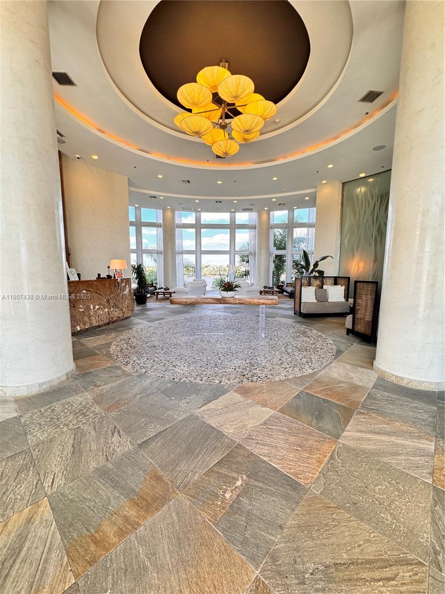 2641 North Flamingo Road, Unit 2208N Sunrise, FL 33323 - Photo 56 of 56 a view of a hall way with furniture and floor to ceiling window