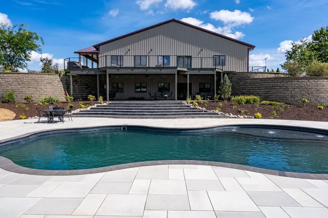 a view of a house with a yard balcony