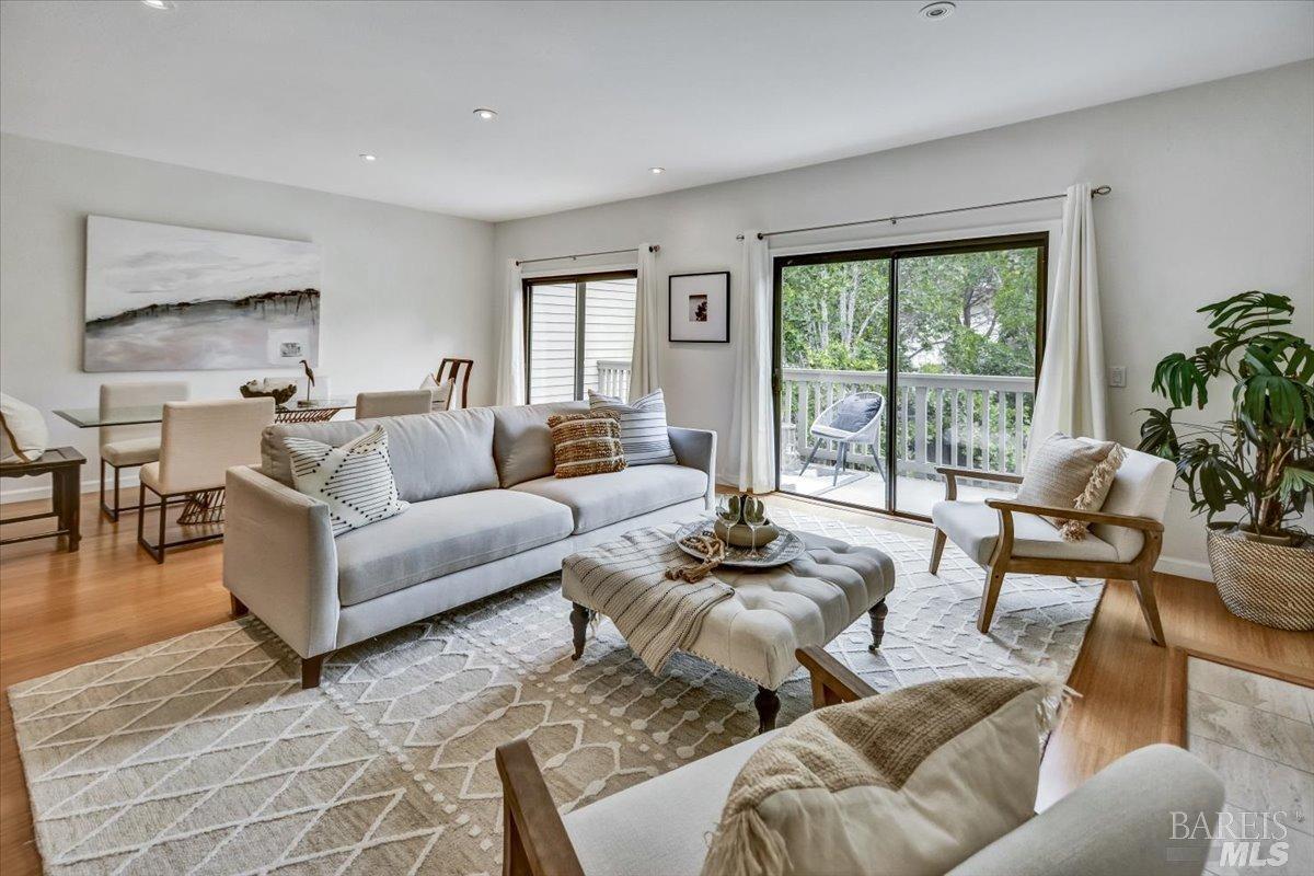 99 Eucalyptus Knoll Street Mill Valley, CA 94941 - Photo 1 of 1 a living room with furniture and a large window