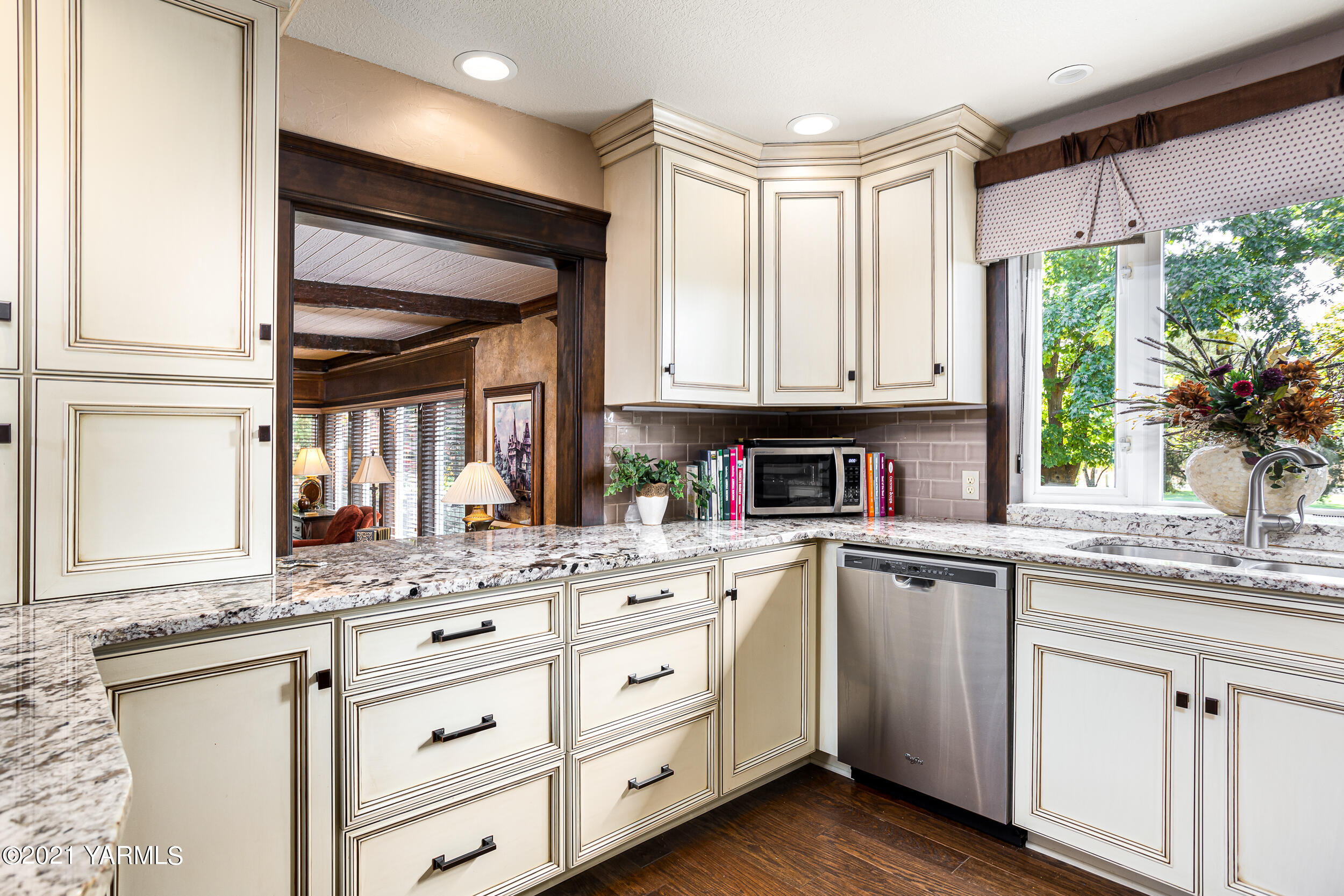 12401 Nelson Road Yakima, WA 98903 - Photo 11 of 48 a kitchen with granite countertop white cabinets and a window