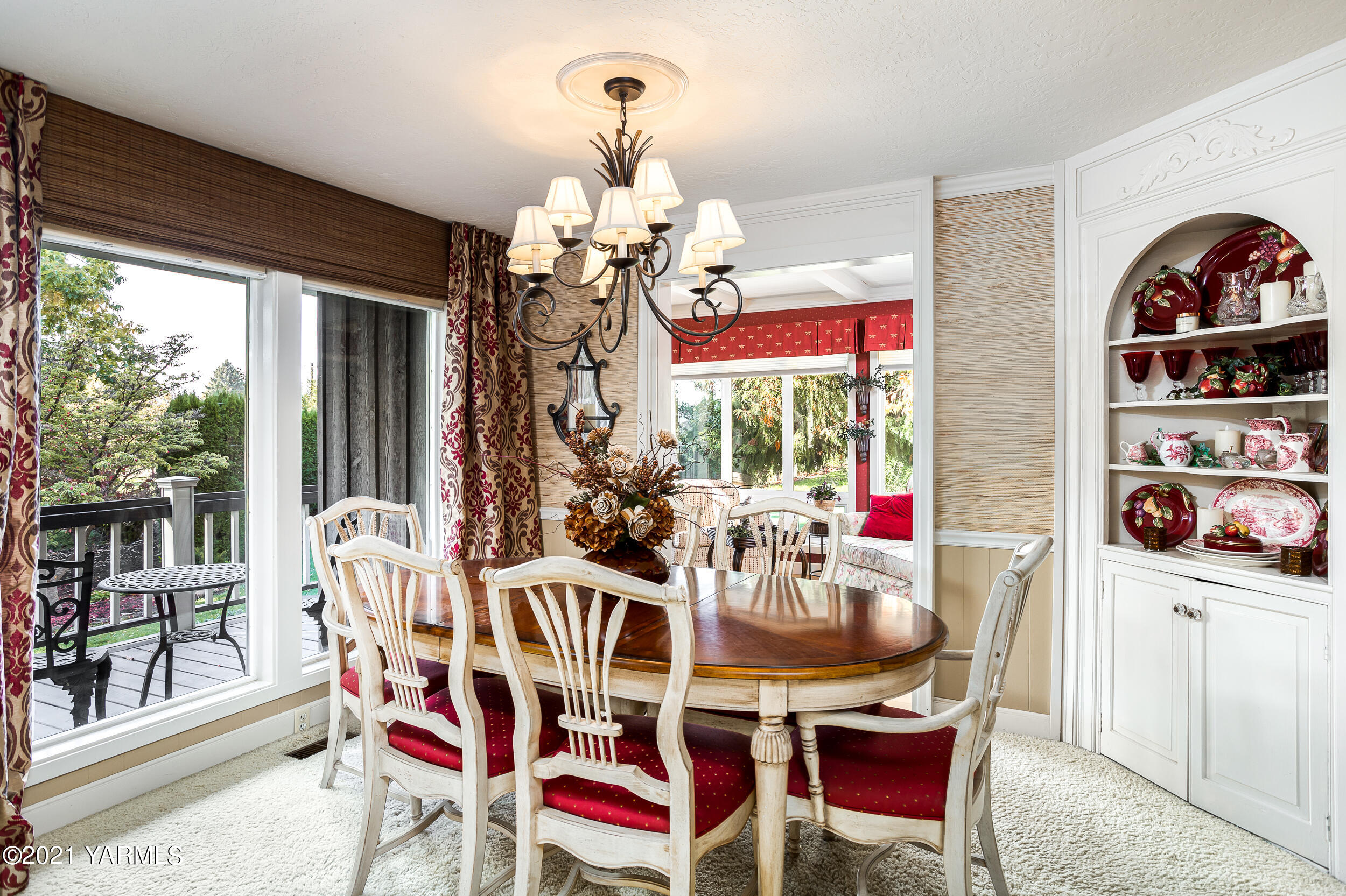 12401 Nelson Road Yakima, WA 98903 - Photo 5 of 48 a view of a dining room with furniture large windows and wooden floor