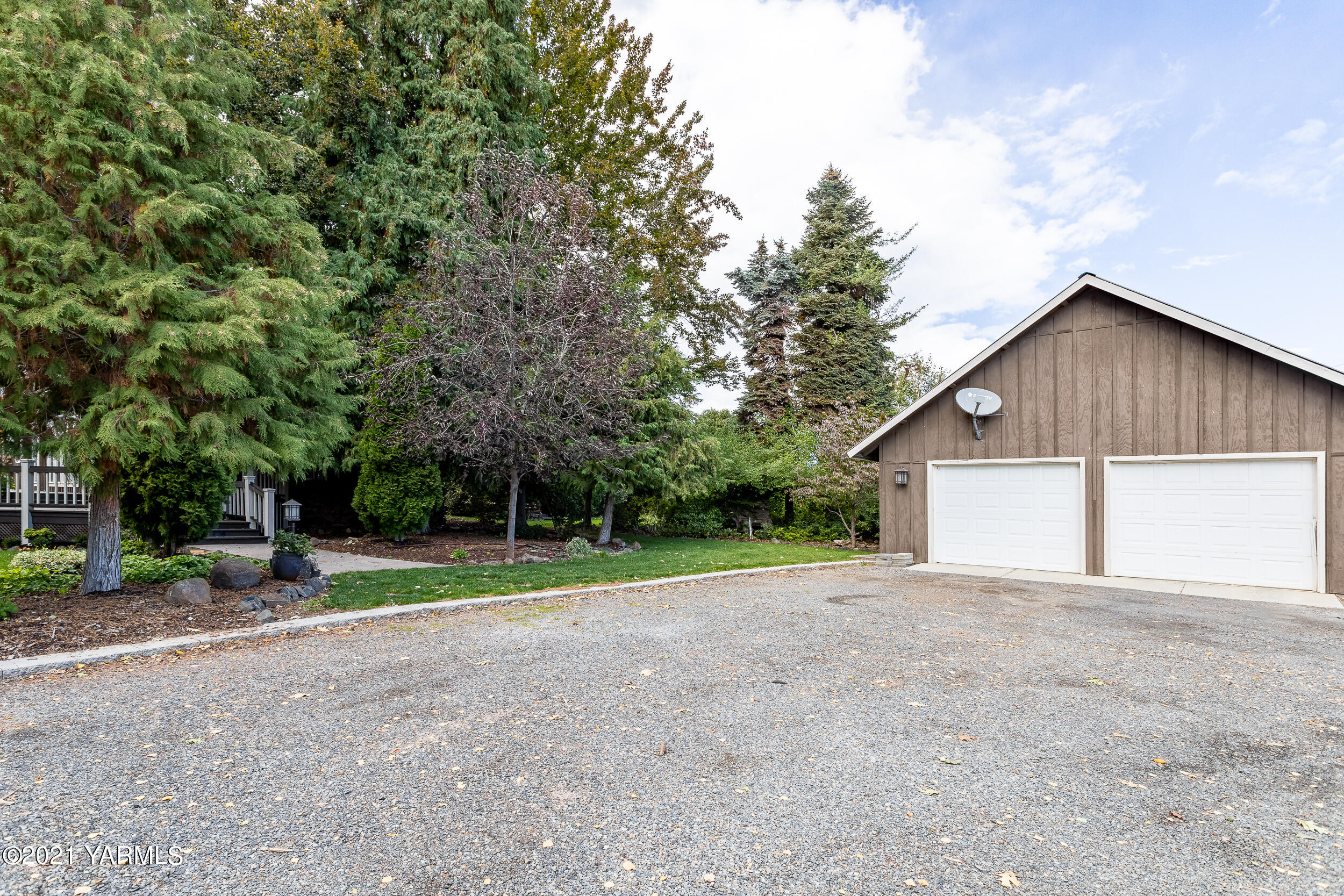 12401 Nelson Road Yakima, WA 98903 - Photo 47 of 48 a view of a house with a yard and large trees