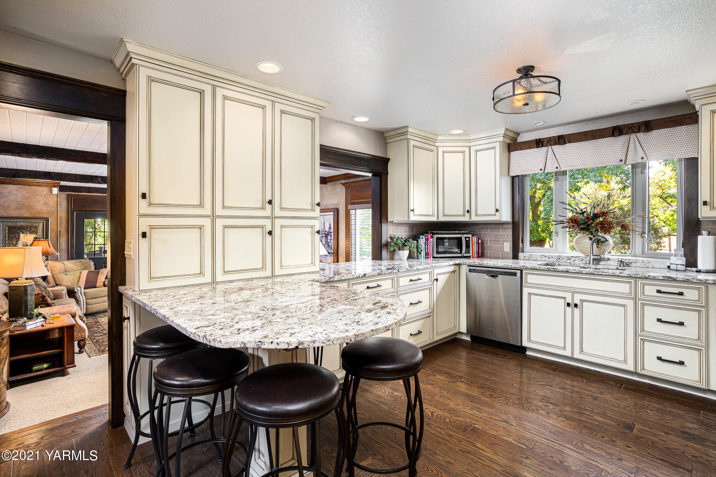 12401 Nelson Road Yakima, WA 98903 - Photo 9 of 48 a kitchen with granite countertop white cabinets and stainless steel appliances