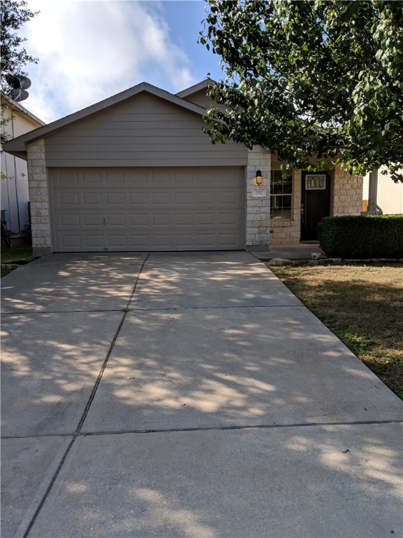 252 Jack Rabbit Lane Buda, TX 78610 - Photo 1 of 1 a front view of a house with a yard