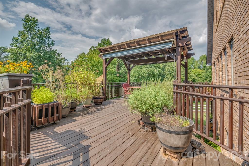 2101 Peniel Road Columbus, NC 28722 - Photo 12 of 48 a view of a chairs on the roof deck